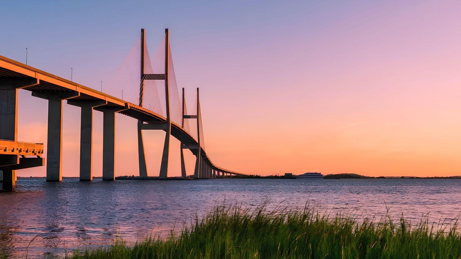 Sidney Lanier Bridge at sunset connecting to Jekyll Island, part of the route from Savannah Georgia