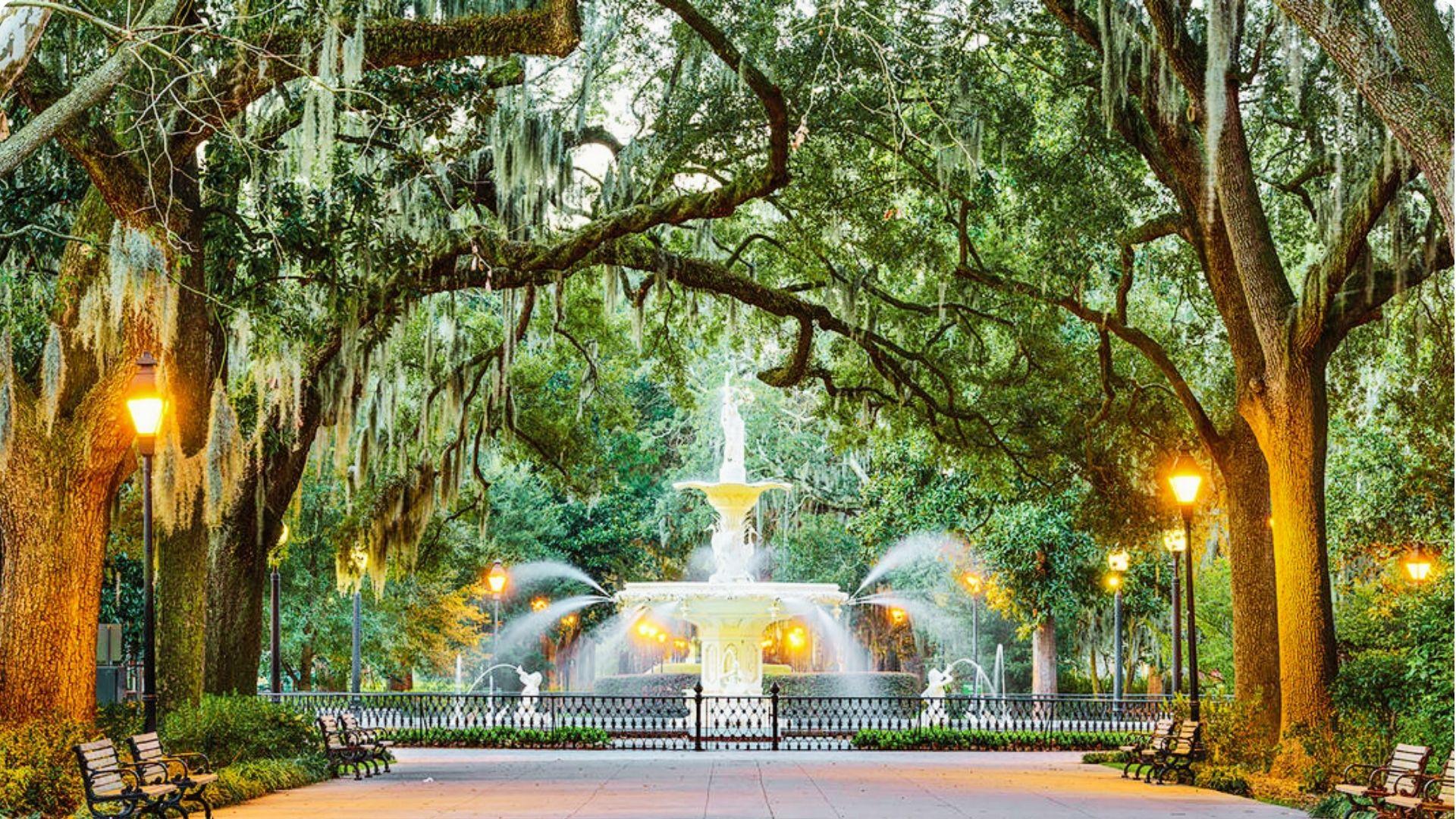 Fountain of Love in Savannah, Georgia, surrounded by lush greenery and historic architecture, symbolizing romance and beauty.