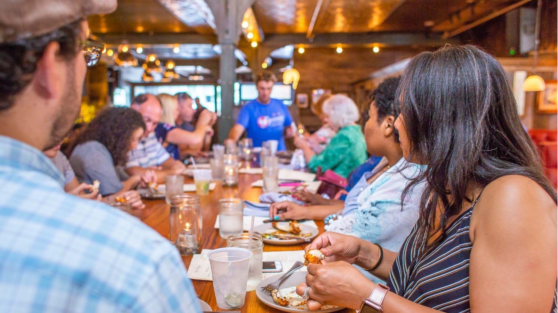 IMAGE OF PEOPLE TRYING OUT FOOD