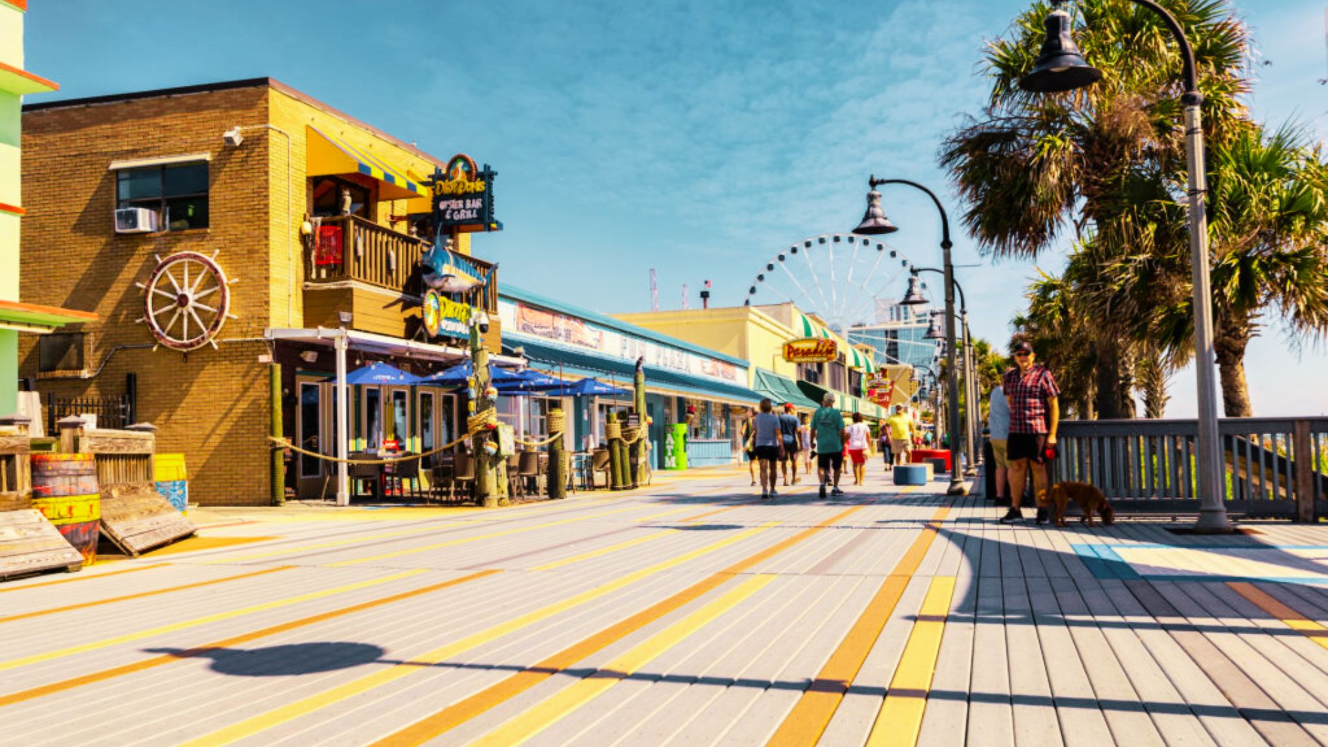 people strolling along the Myrtle beach.