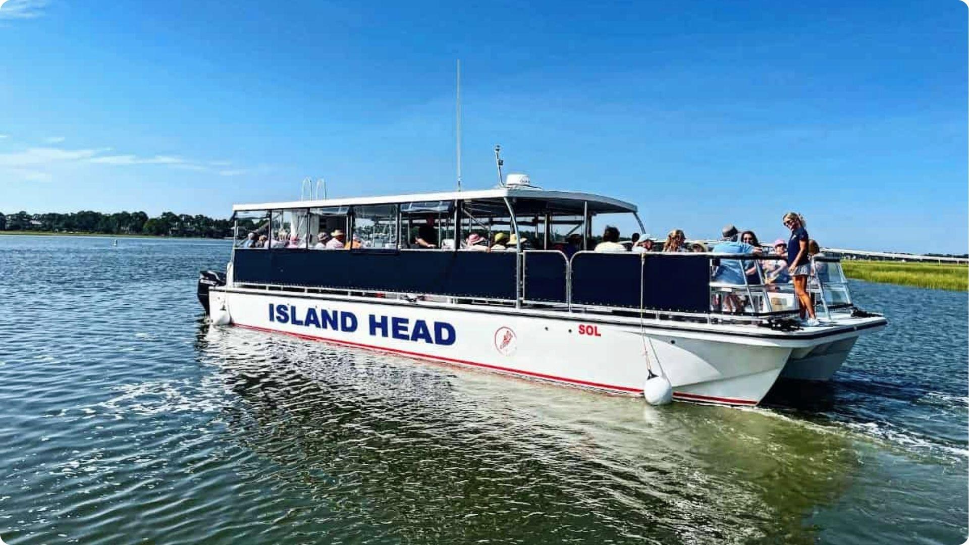 Island Head SOL ferry packed with passengers navigating marsh waters en route to Daufuskie Island