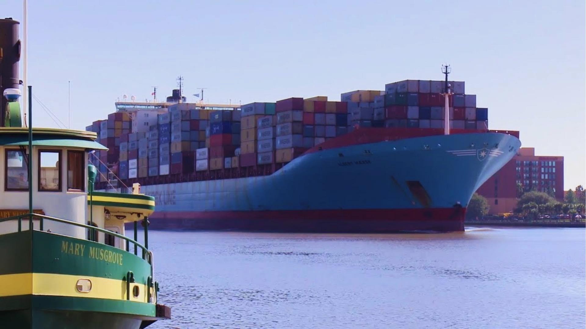 Massive Maersk container ship passing Mary Musgrove ferry on Savannah River near River Street.