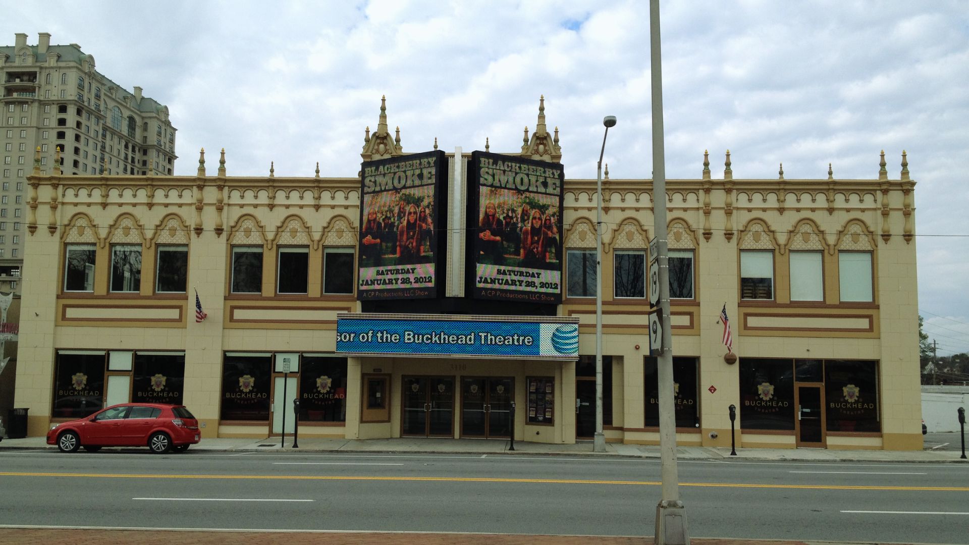 Buckhead Theatre facade in Atlanta featuring illuminated marquees and historic architectural details along Peachtree Road.