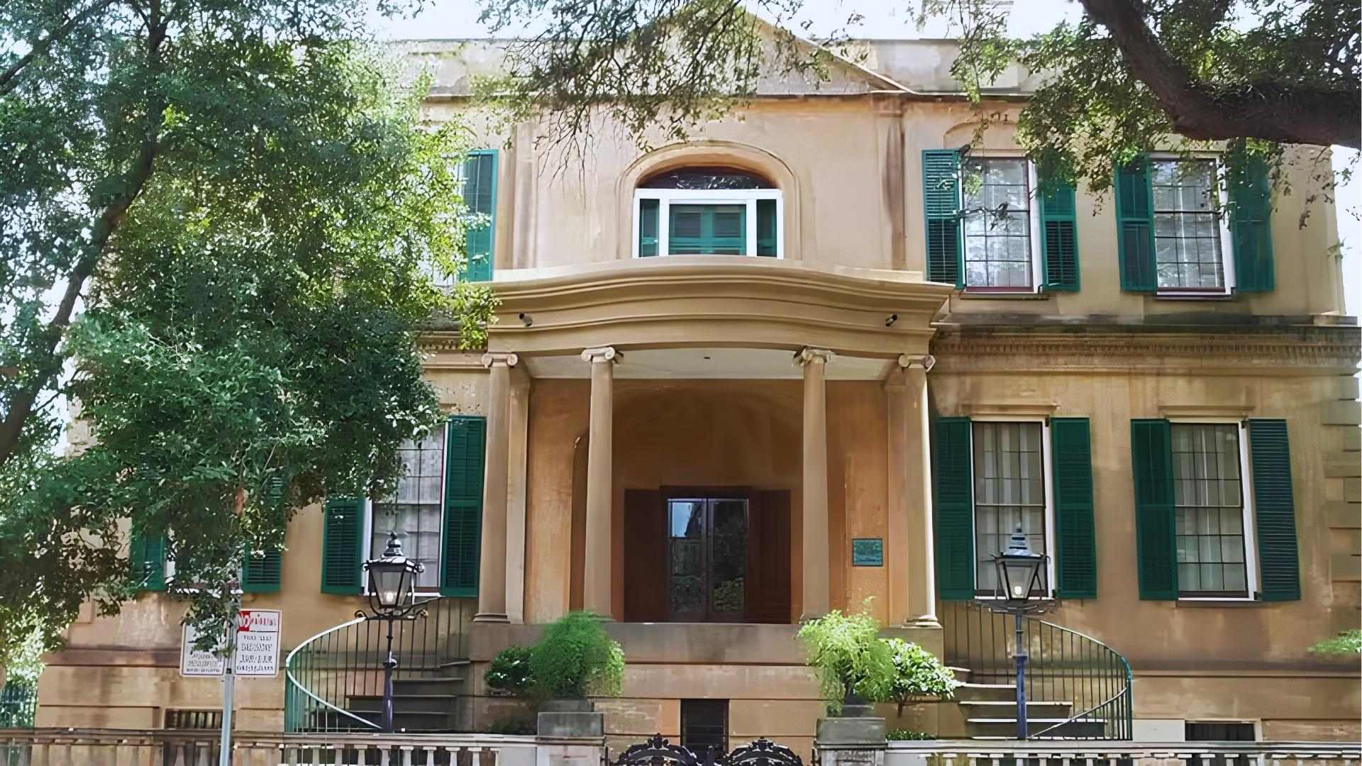 Owens-Thomas House historic mansion with green shutters and curved steps in Savannah.