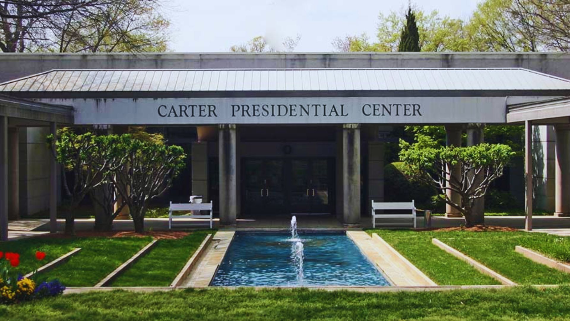 Entrance to the Carter Presidential Center with reflecting pool and landscaped gardens in Atlanta Georgia.