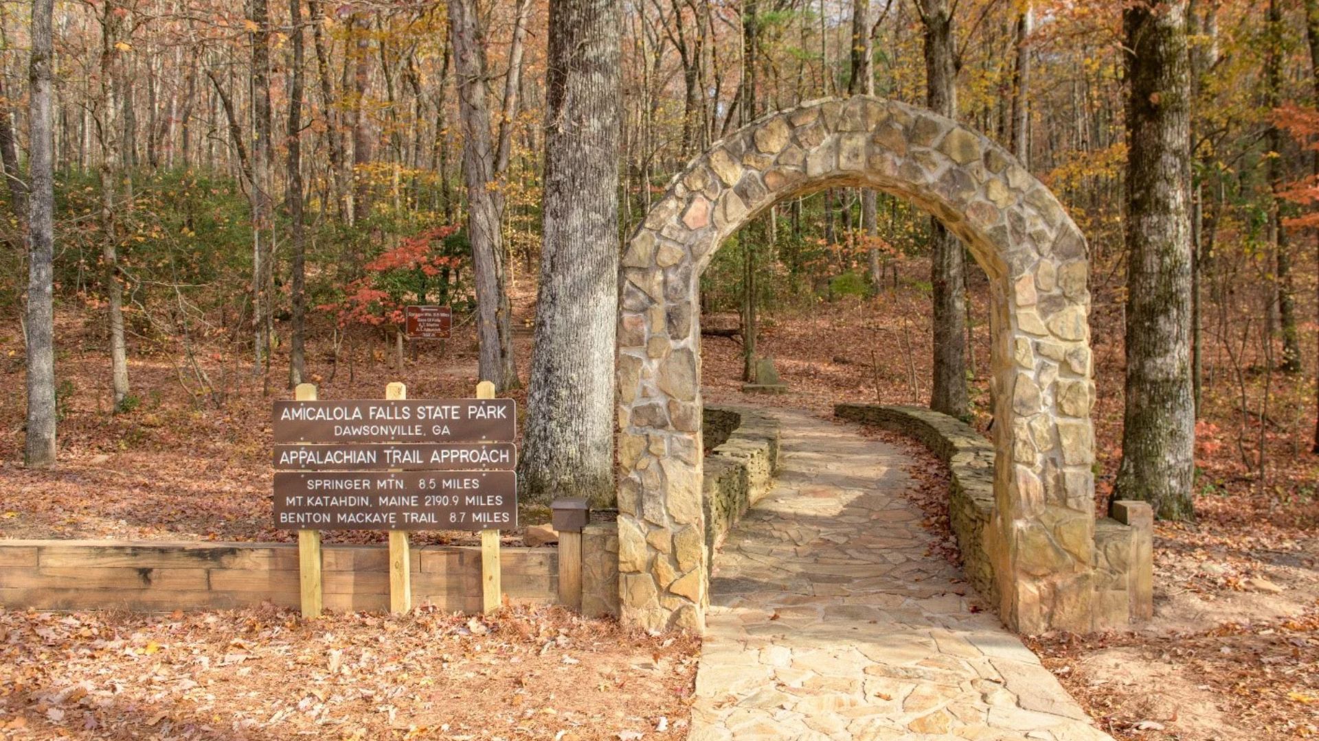 Stone arch and trail sign mark the Amicalola Falls State Park.