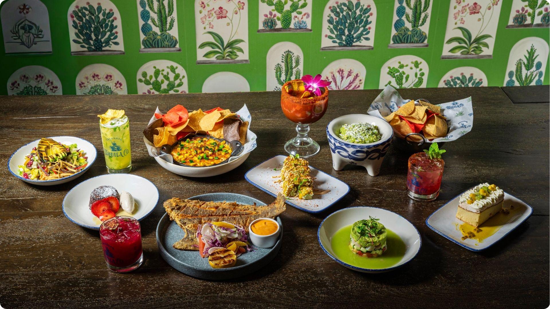Vibrant Mexican dinner spread with tacos guac and cocktails for best dinner savannah ga nightlife