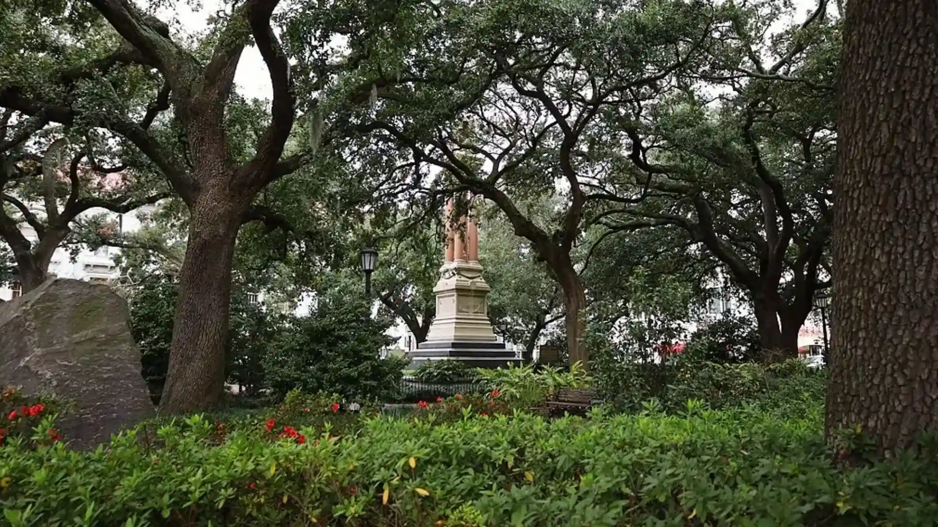 Monument to William Washington Gordon with red columns under live oaks in Wright Square, Savannah.
