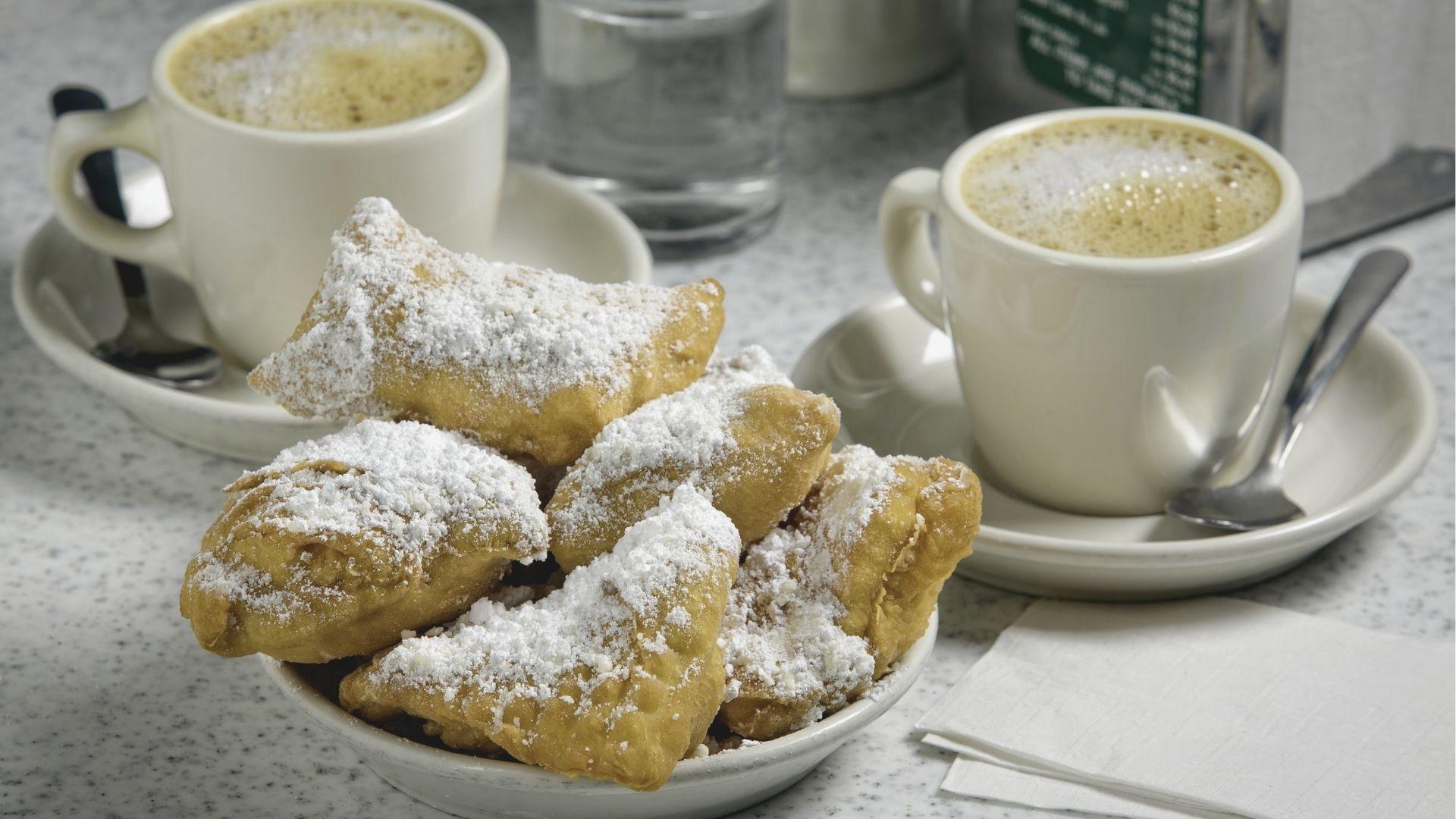 Indulge in fresh beignets dusted with powdered sugar, a French Quarter staple.
