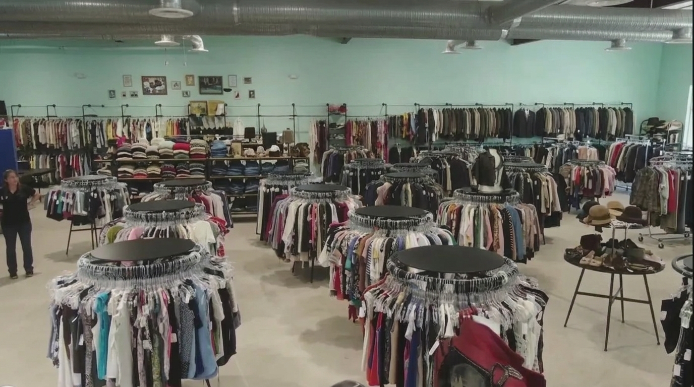Spacious Savannah GA thrift store with circular racks of clothing, hats, and accessories galore.