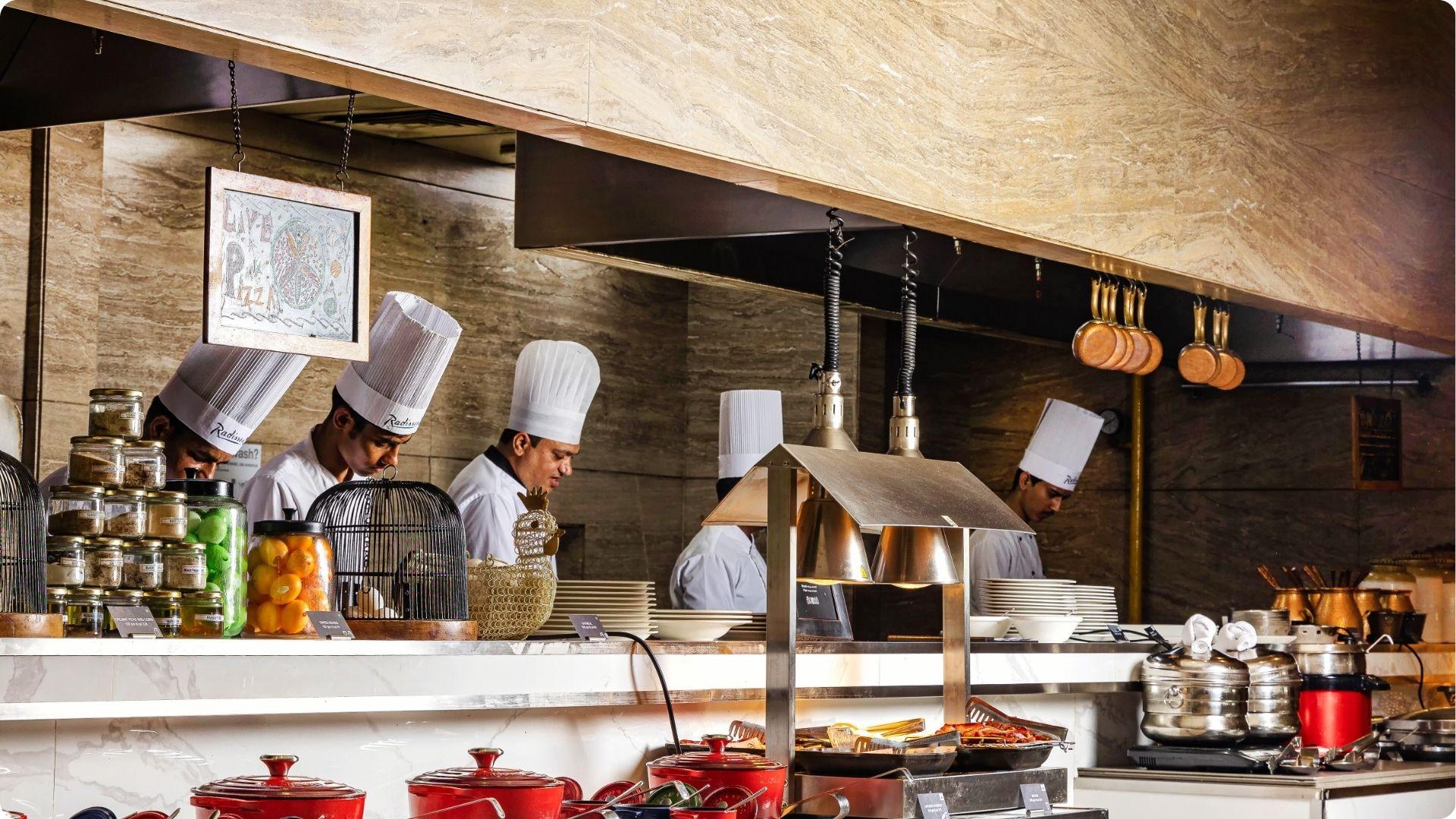 Live kitchen chefs preparing gourmet pizza at upscale buffet for best dinner savannah ga experience