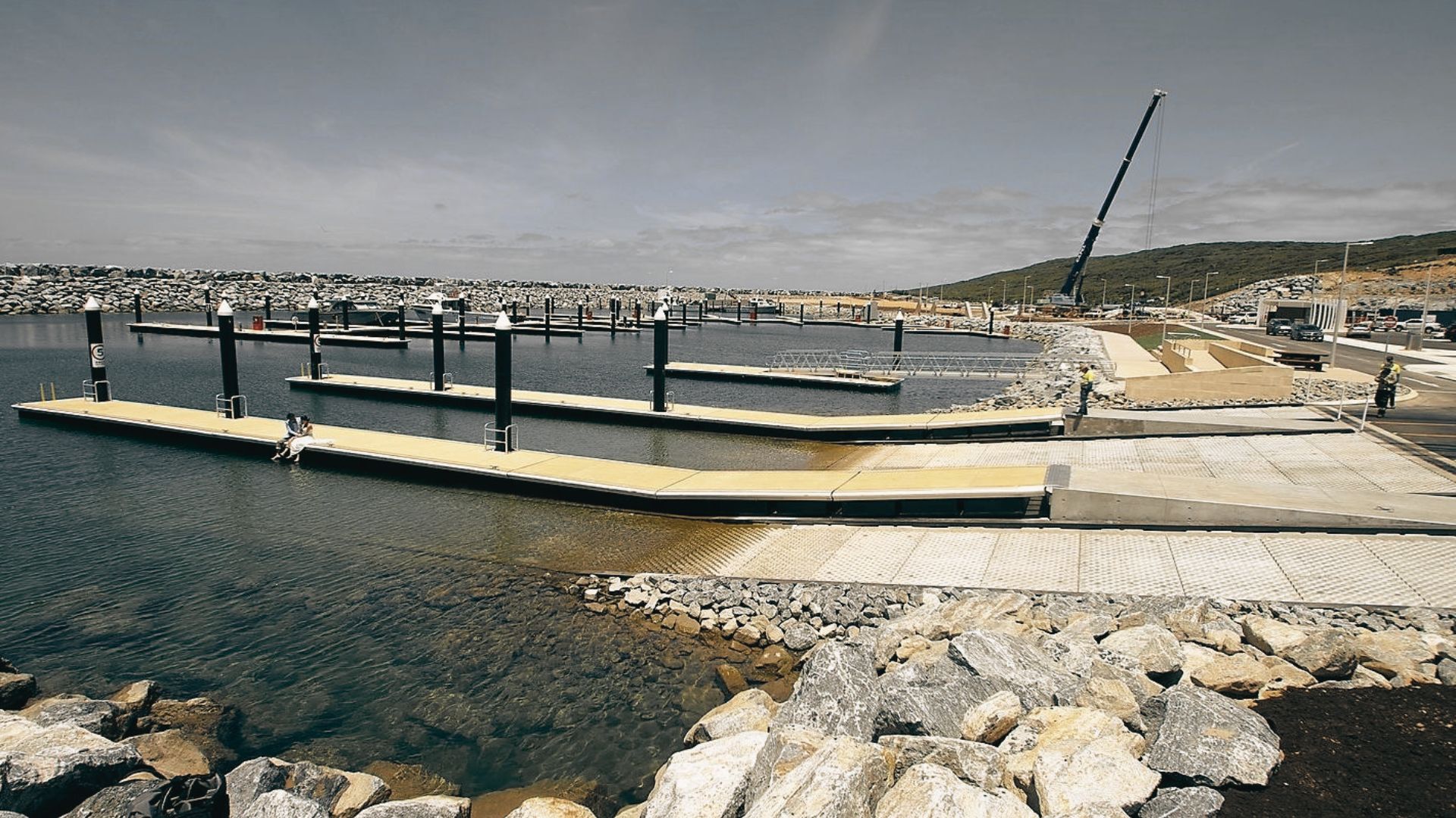 Augusta Boat Dock with floating piers and calm waters beside a rocky shoreline.