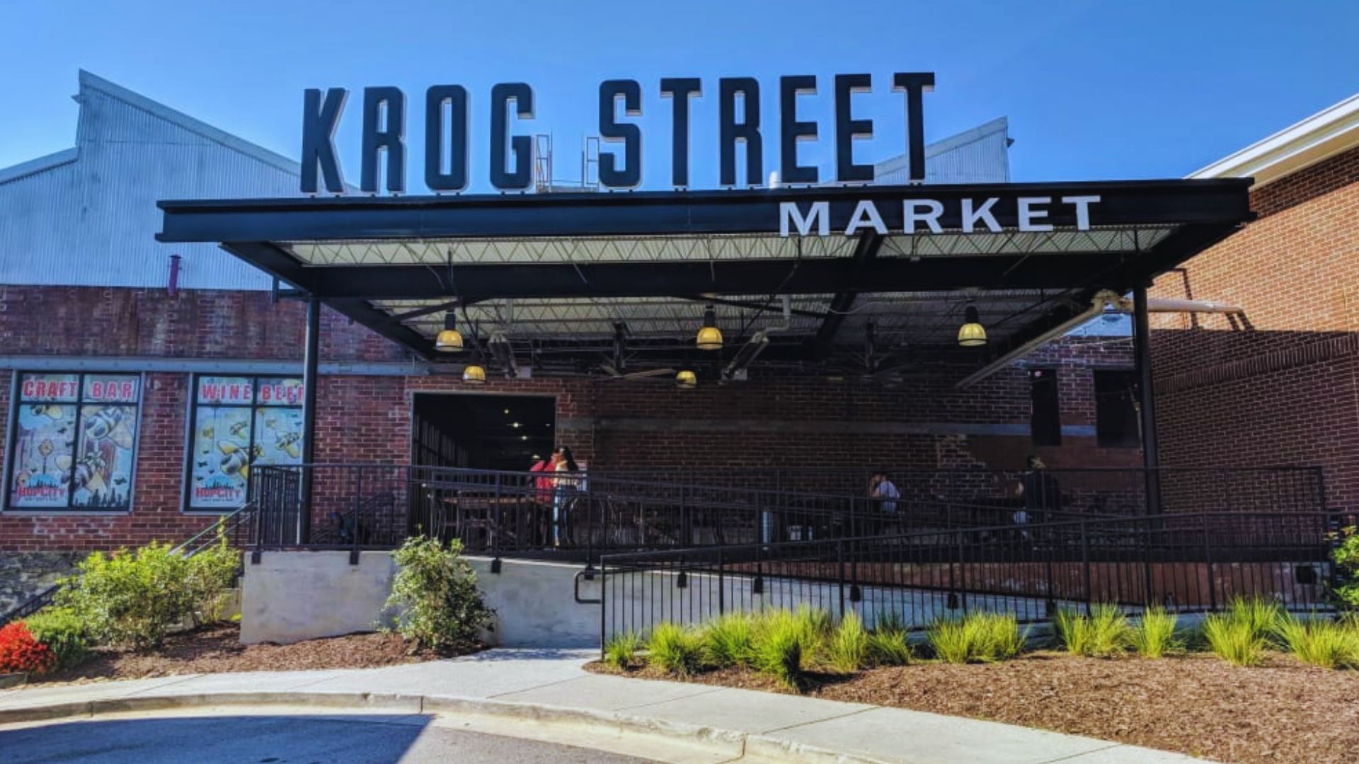 Krog Street Market entrance featuring industrial architecture, brick facades, and outdoor gathering spaces in Atlanta.