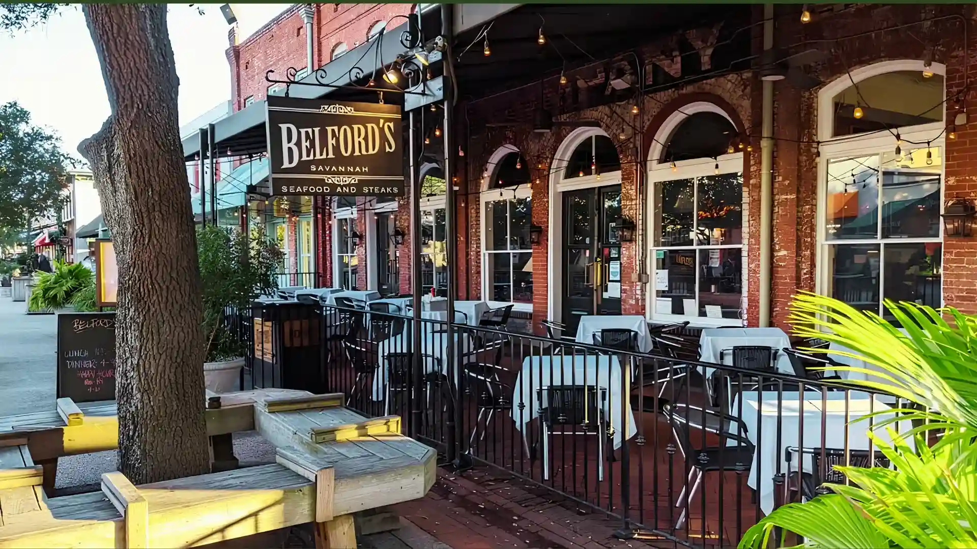 Outdoor seafood restaurant patio welcoming dogs in Savannah.