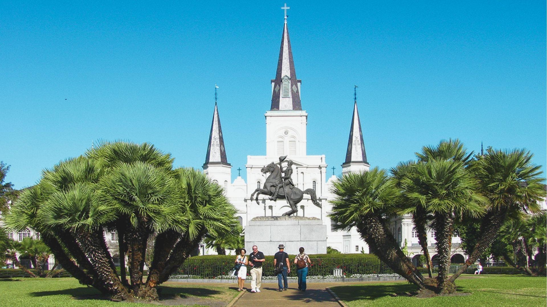 Visit Jackson Square to see St. Louis Cathedral framed by palm trees and the Andrew Jackson statue.