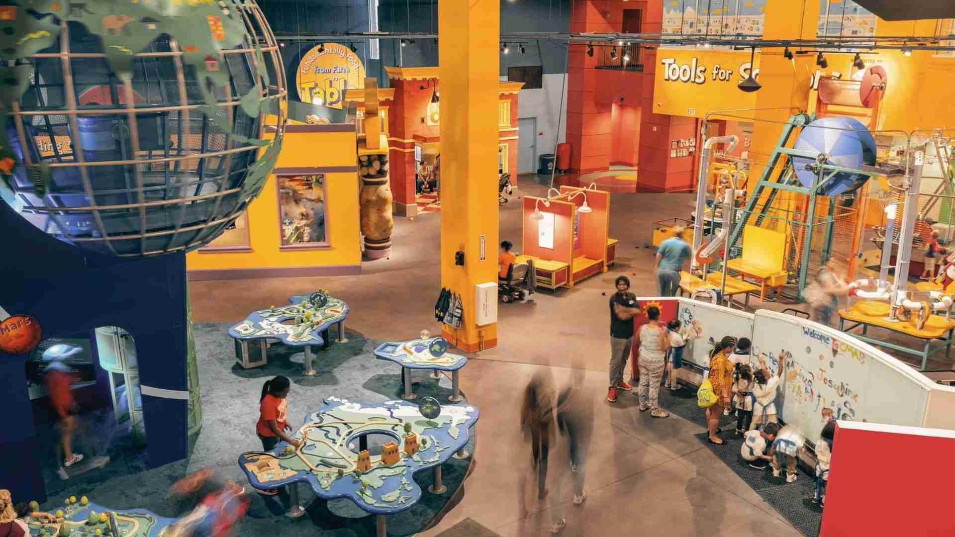 Families explore interactive exhibits and hands-on learning activities inside Children's Museum of Atlanta.