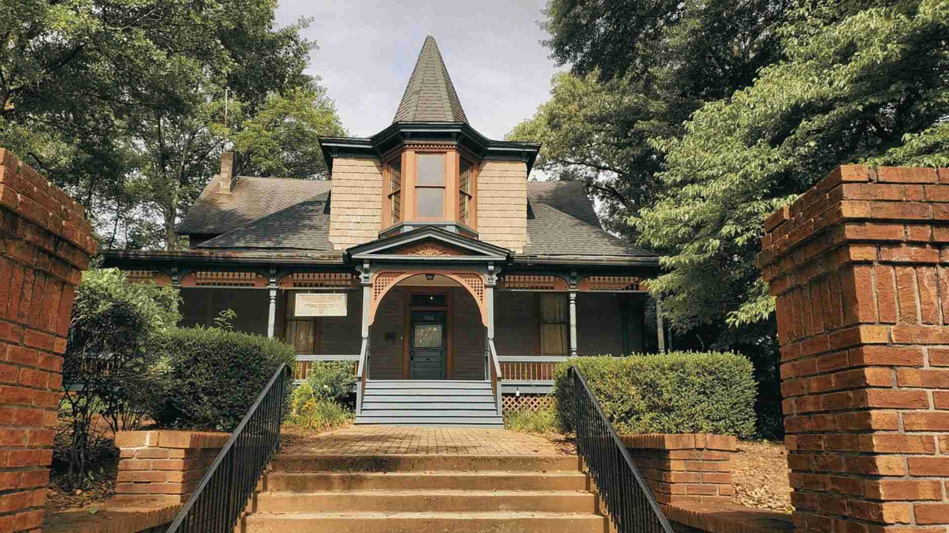 Hammonds House Museum historic home surrounded by trees and brick pathways in Atlanta's West End neighborhood.