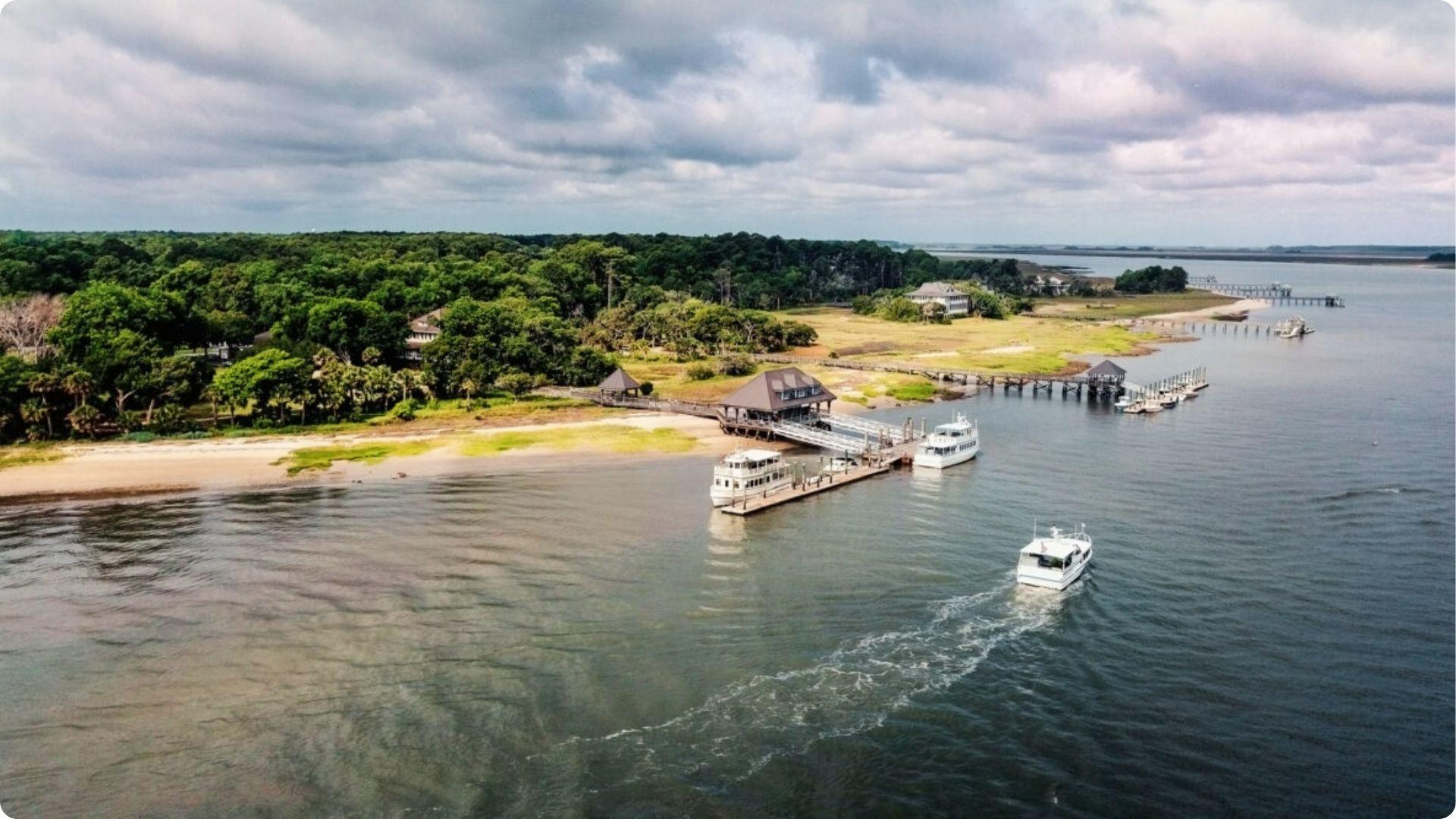 Scenic aerial view of Daufuskie Island dock with ferries arriving to transport visitors ashore