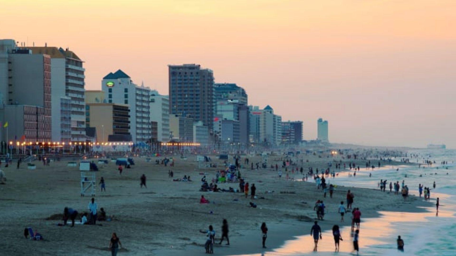 Crowded city beach boardwalk at sunset near Savannah GA