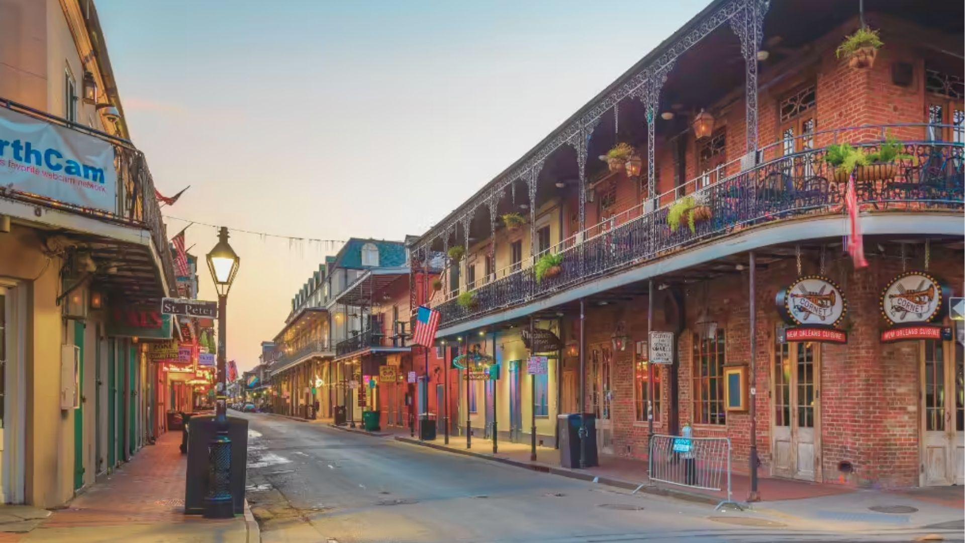 Walk the quiet streets of the French Quarter at sunrise past brick buildings with lacy balconies.