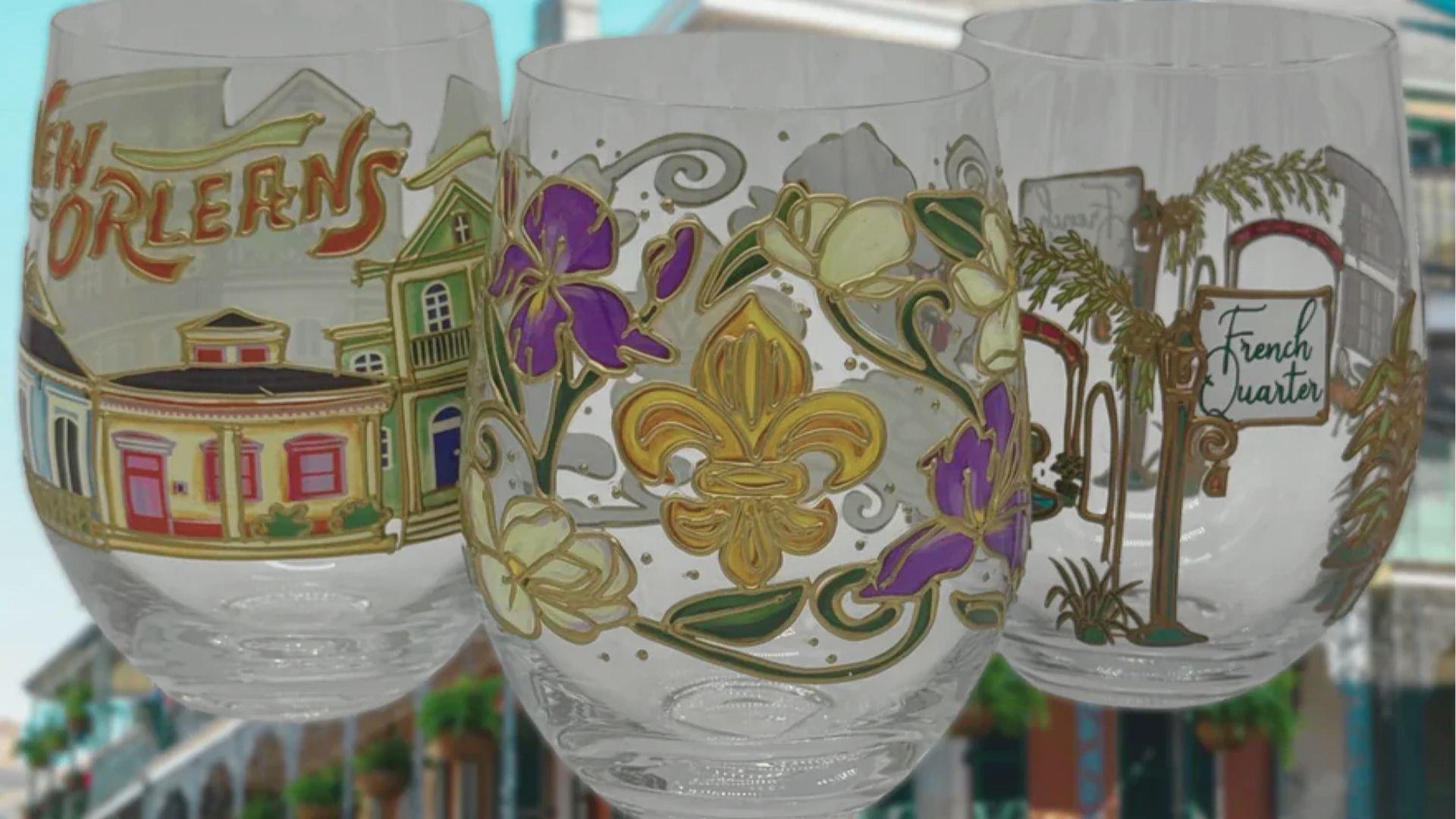 Shop for New Orleans souvenirs like hand-painted wine glasses featuring fleur-de-lis and French Quarter scenes.