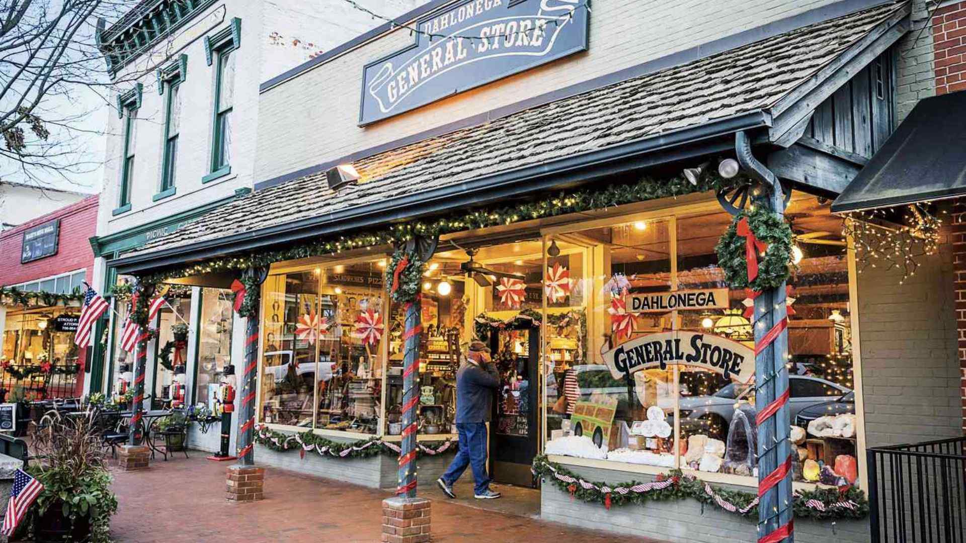 Front view of a general store in Dahlonega, GA, adorned with festive Christmas decorations.