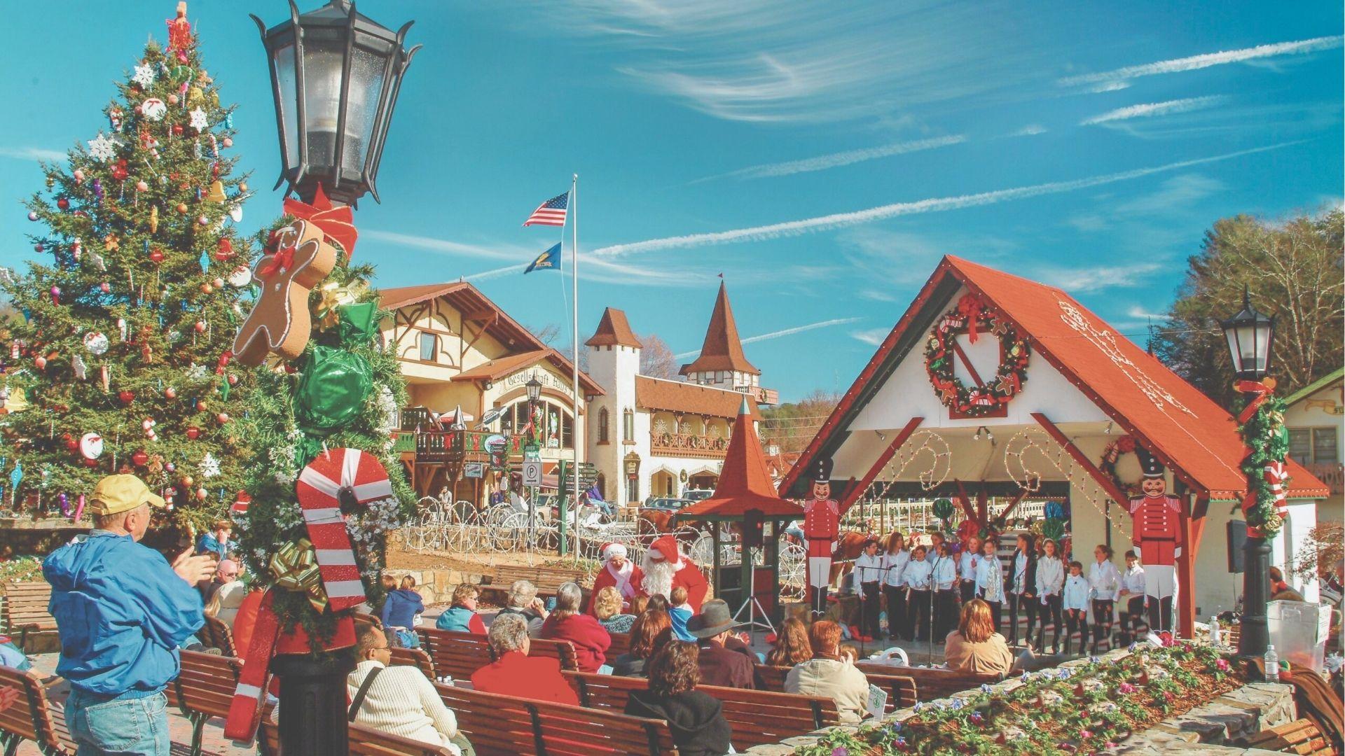 Daytime view of Helen’s Marktplatz with a decorated Christmas tree, lamppost candy canes, and a children’s choir.