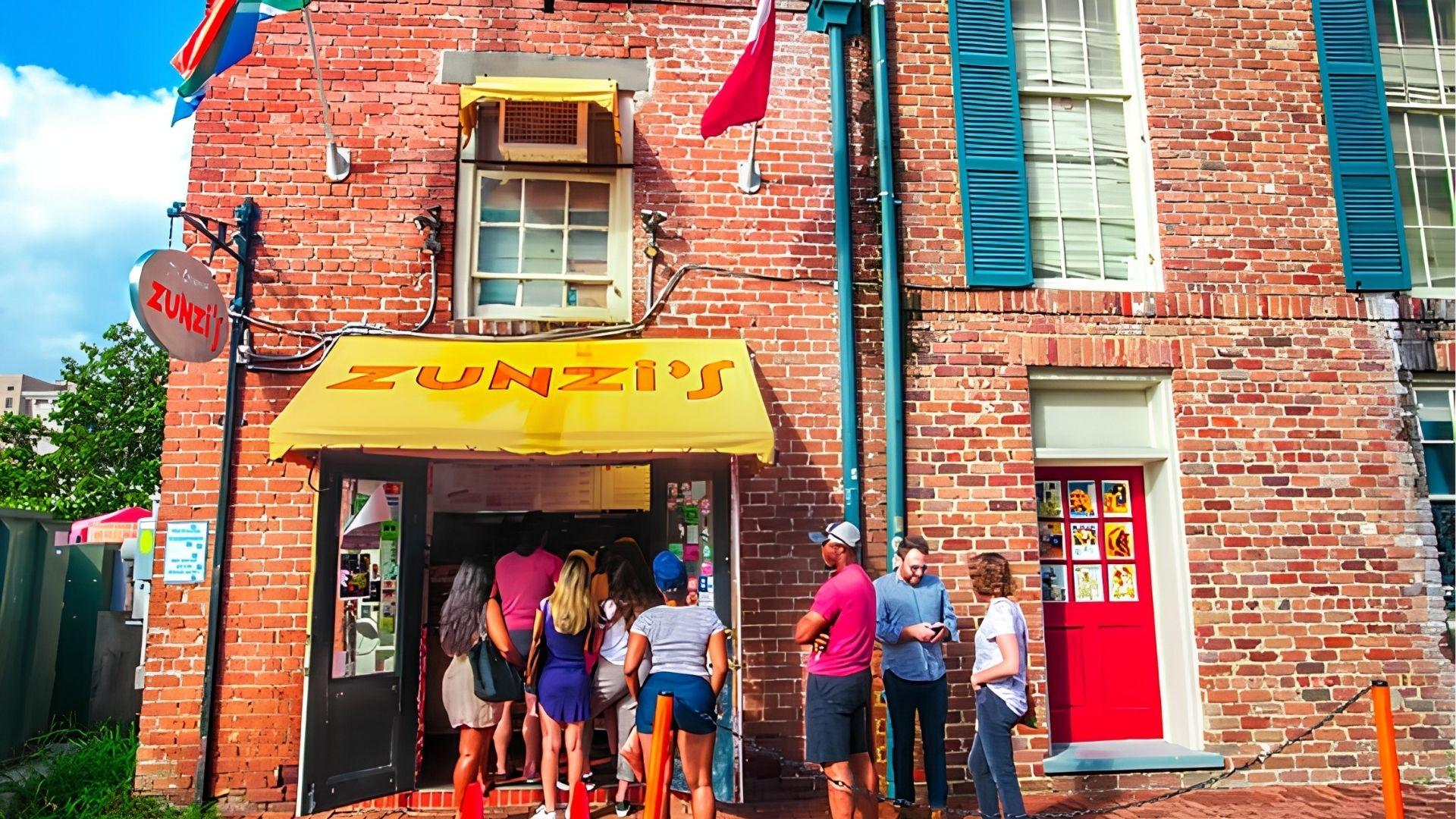Zunzi’s brick exterior on the corner of the street. Tight, small space, perfect for takeaways.