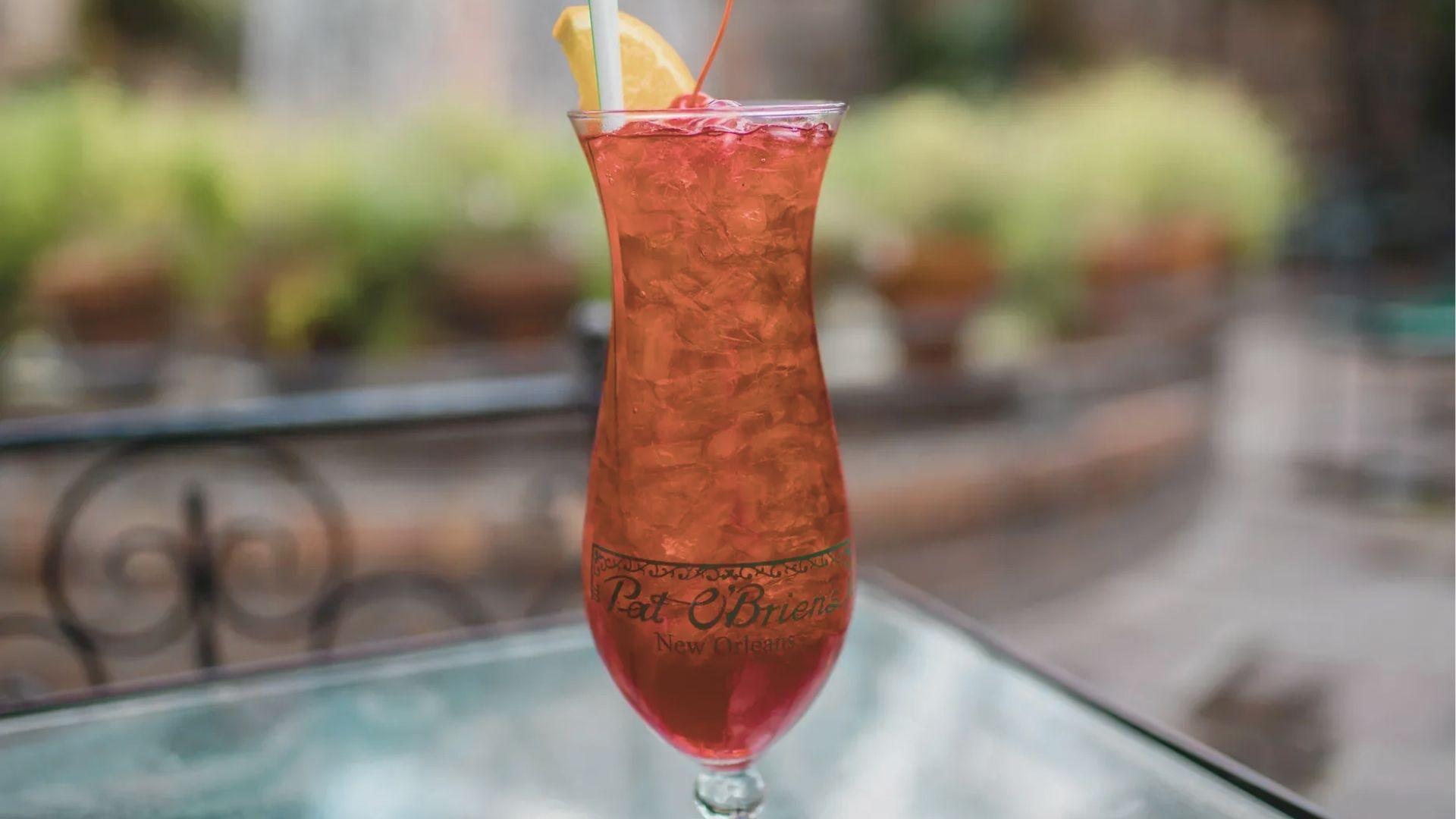 Sip a famous Hurricane cocktail in a tall glass from Pat O’Brien’s, a French Quarter institution.