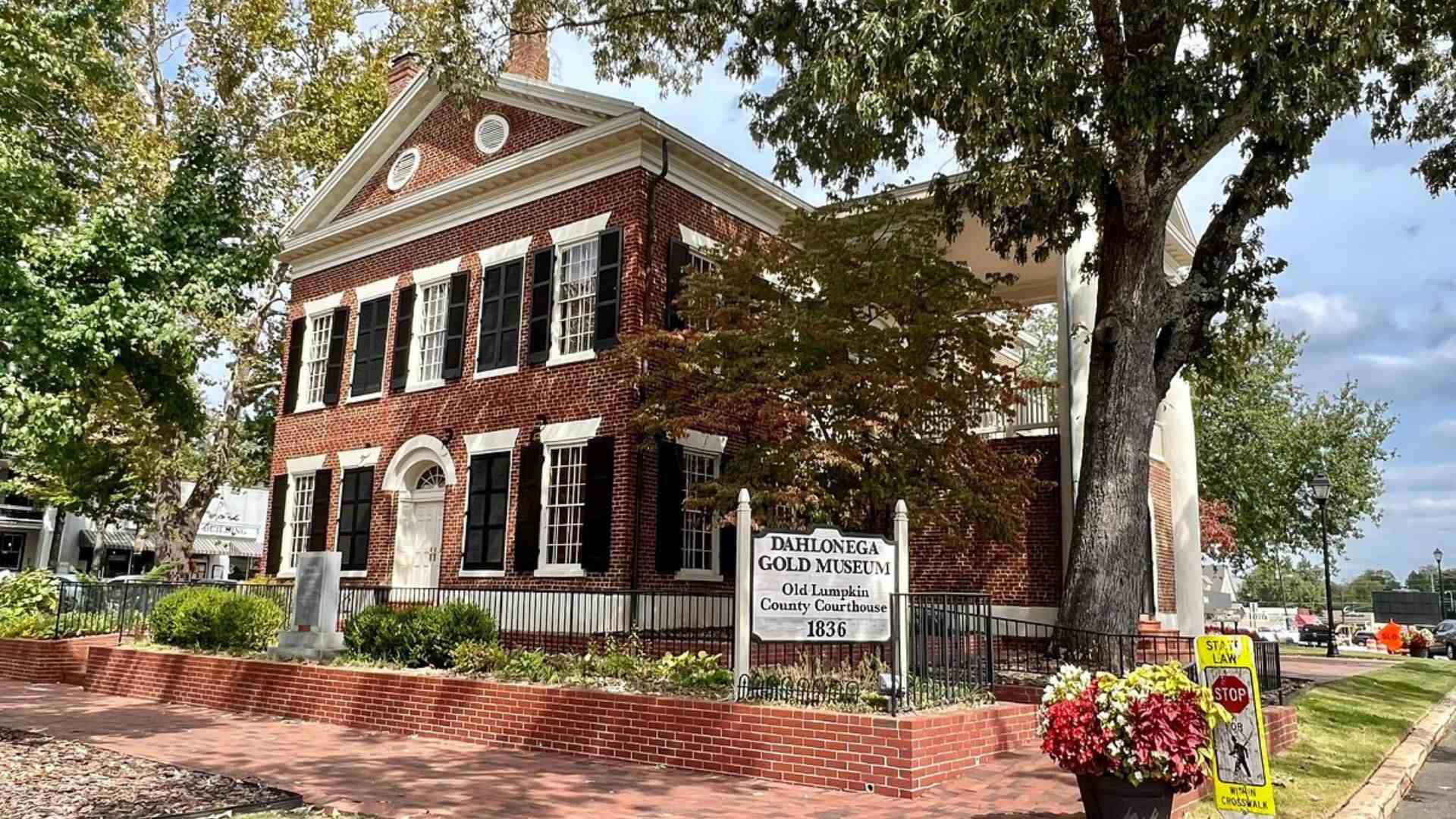 Historic brick building of the Dahlonega Gold Museum located at a street corner, showcasing its architectural charm.