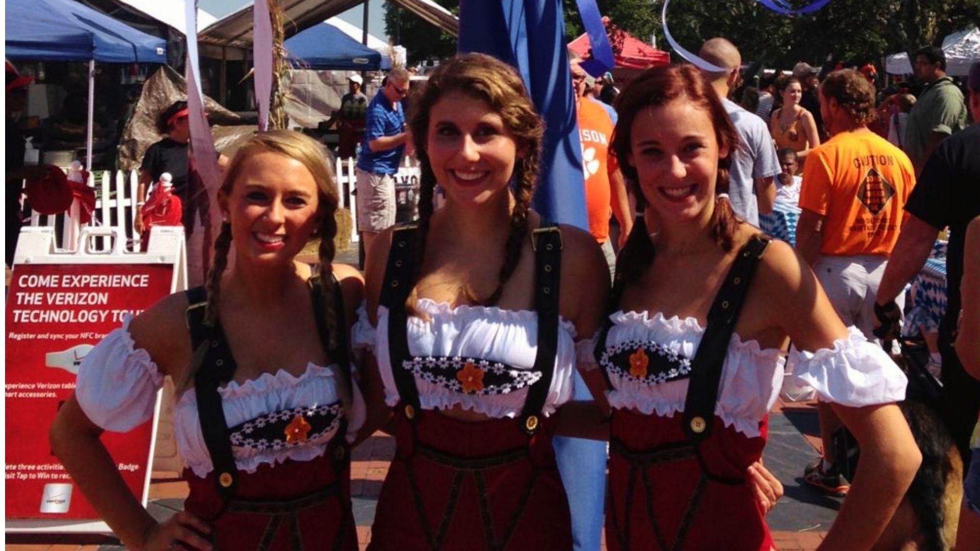 Women in dirndl dresses celebrating Oktoberfest festival in downtown Savannah Georgia