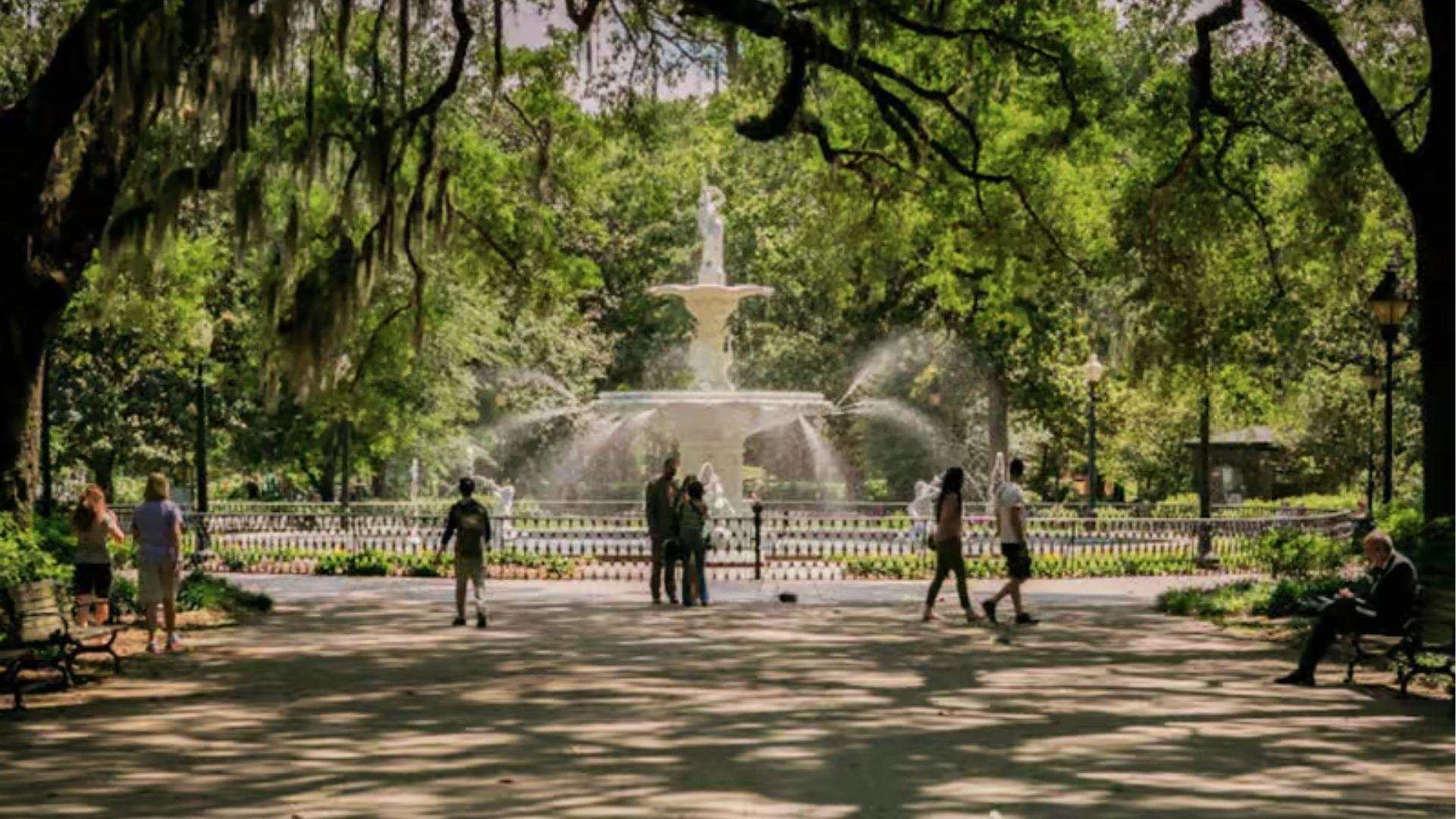Famous Forsyth Park fountain surrounded by oak trees in Savannah Georgia in October