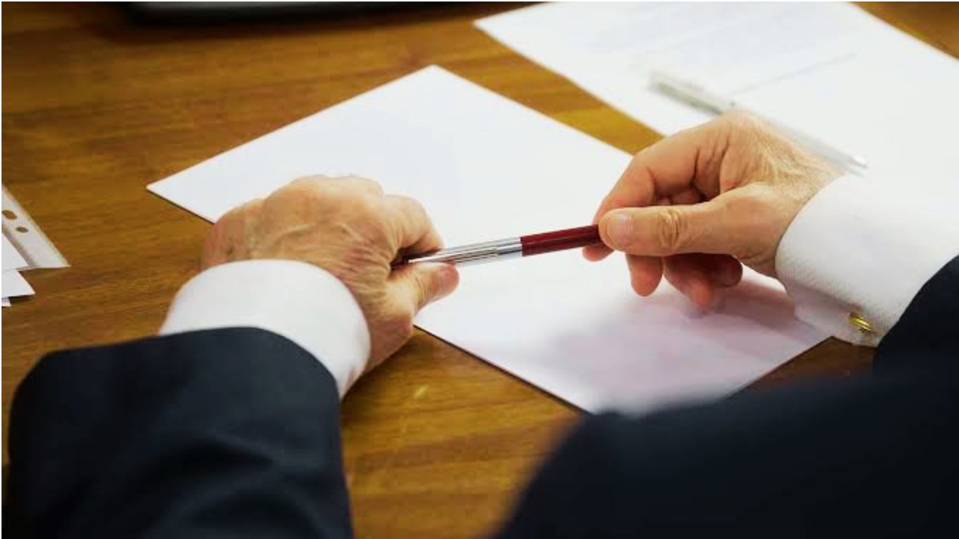 Person signing legal document related to common law marriage in Georgia