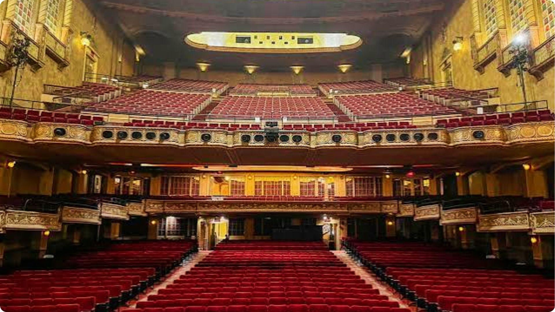 Elegant historic theater with red seats and balconies, live show venue for couples in Myrtle Beach