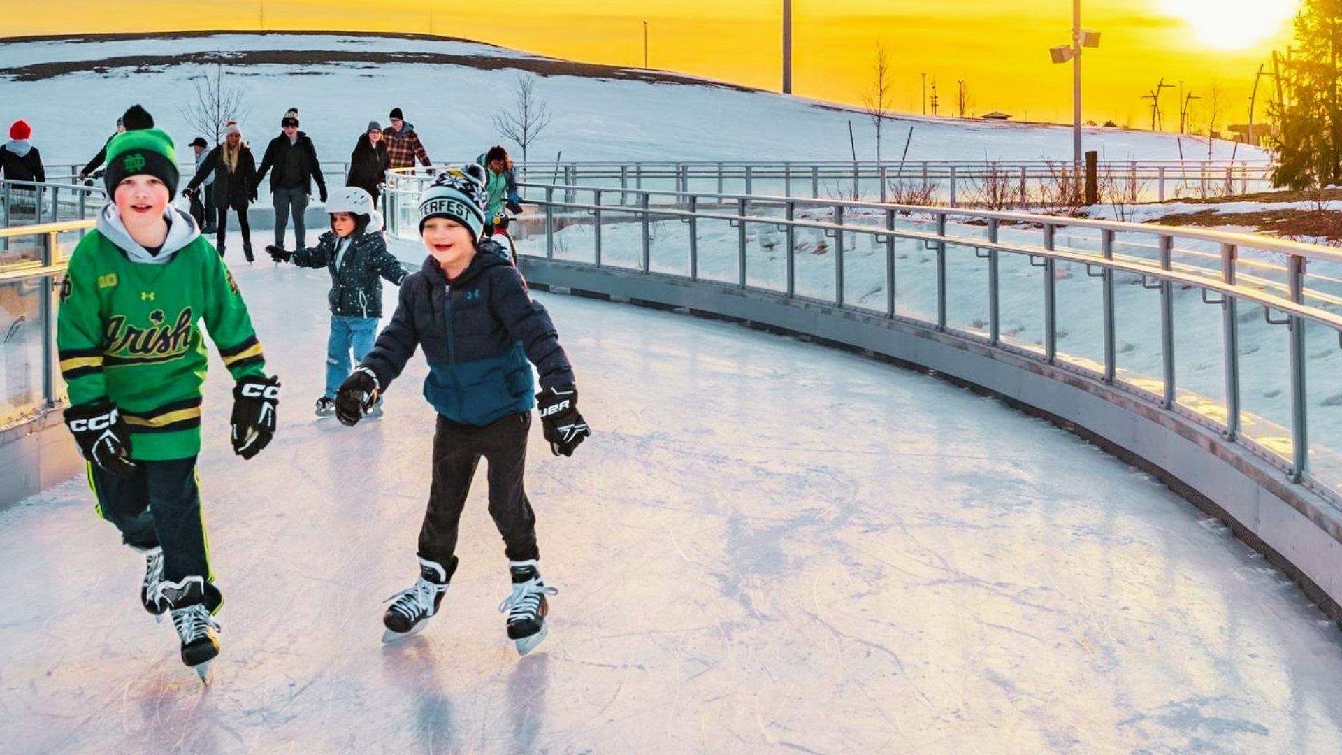kids enjoying ice skating in winter.