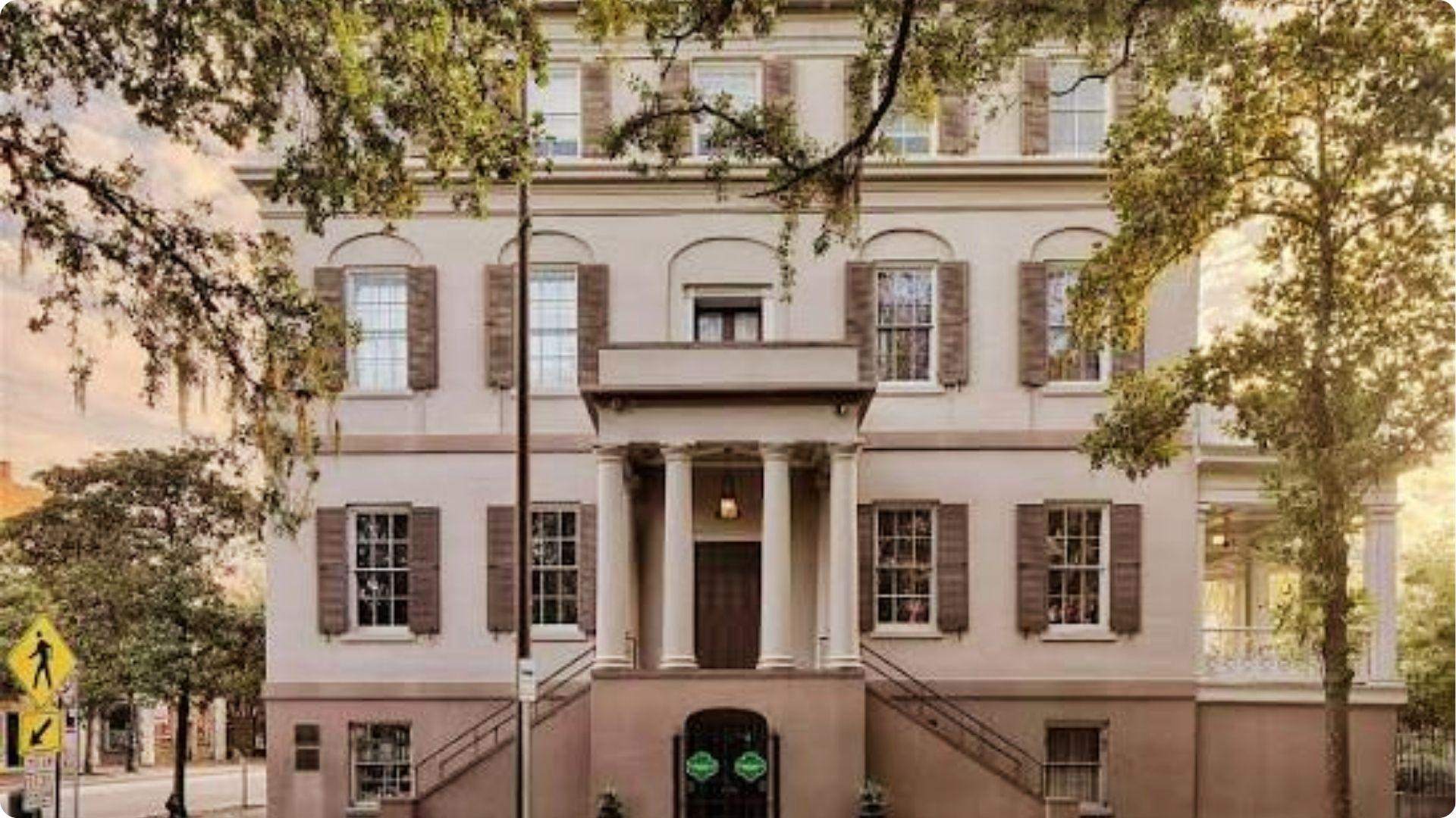 Historic Juliette Gordon Low Birthplace house with columns and oak trees in Savannah Georgia
