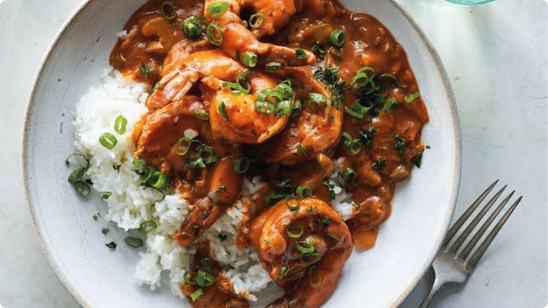 Spicy shrimp creole smothered in rich Creole sauce over white rice, classic New Orleans comfort.