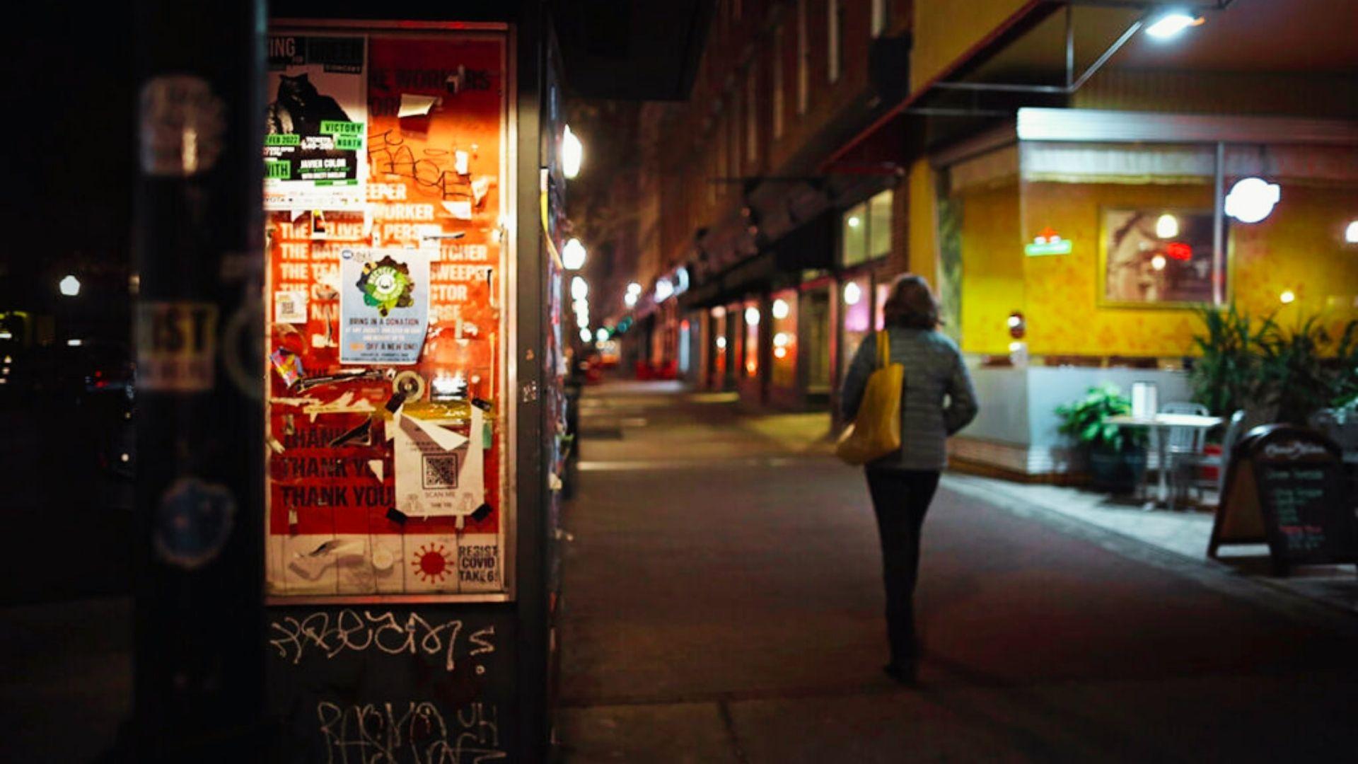 a woman walking alone at night in Savannah.