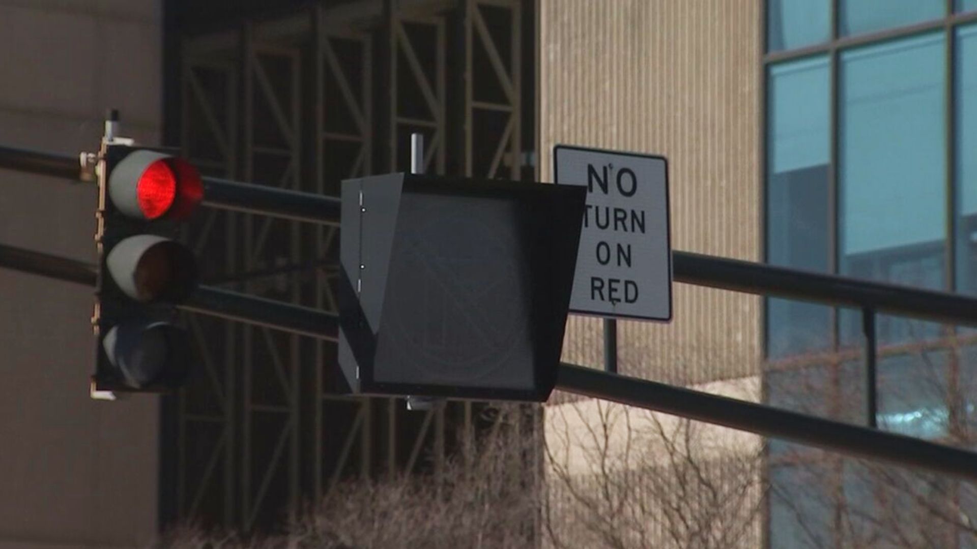 Traffic light on red with No Turn On Red sign at urban intersection