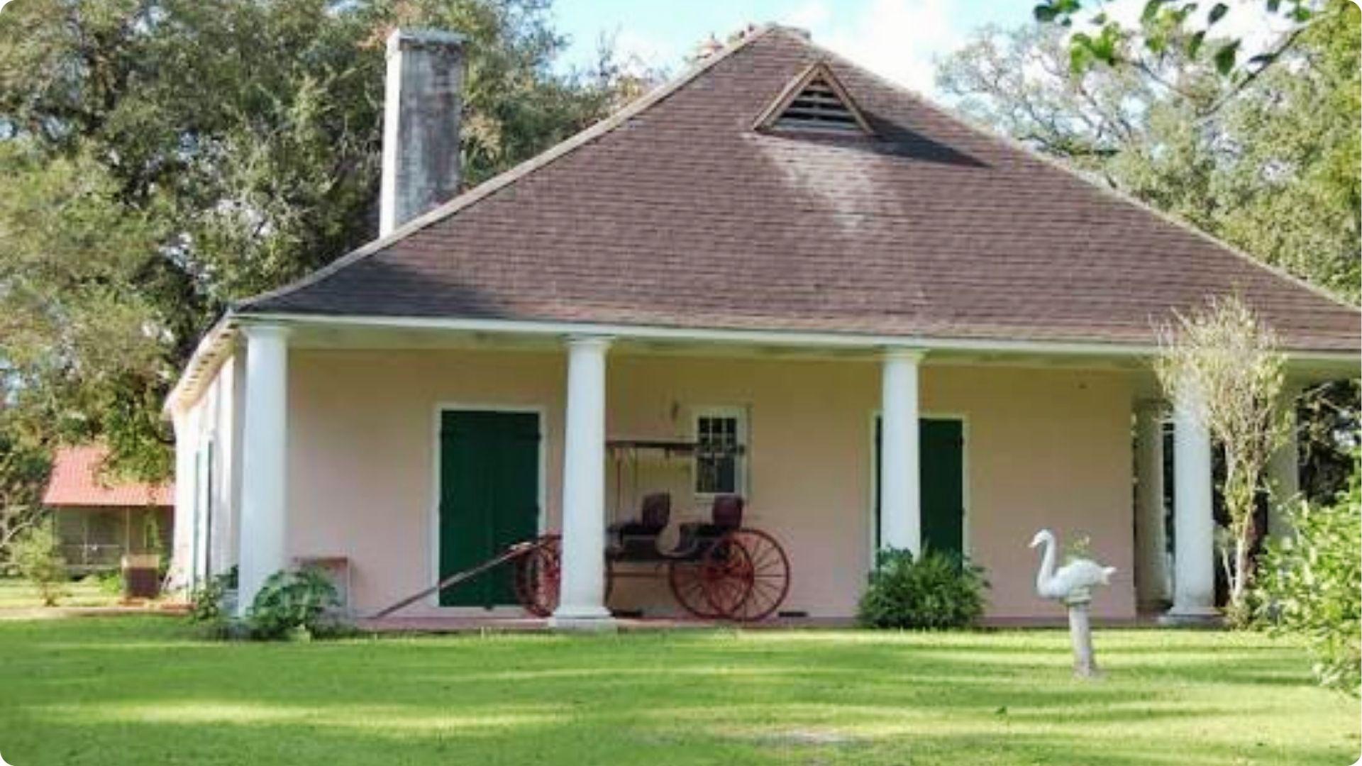Charming Creole cottage with columns and carriage, historic house tour in New Orleans French Quarter
