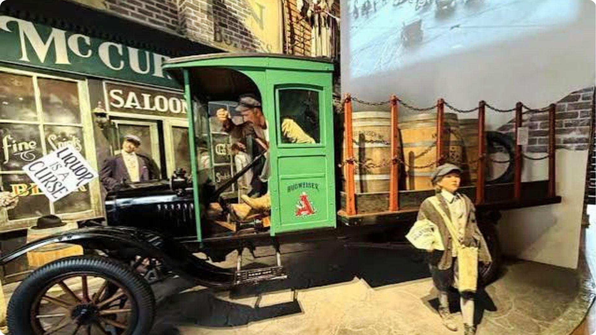 Prohibition museum exhibit with vintage Budweiser truck and saloon backdrop in Savannah Georgia