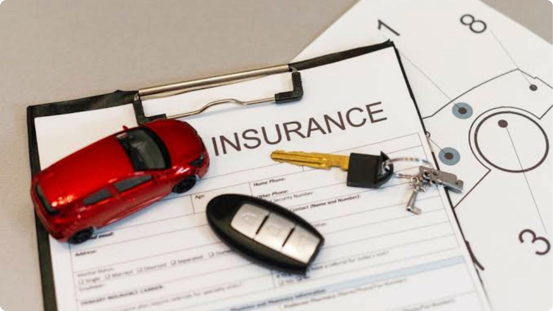 Car insurance claim form with toy car and keys, understanding Georgia at-fault system.