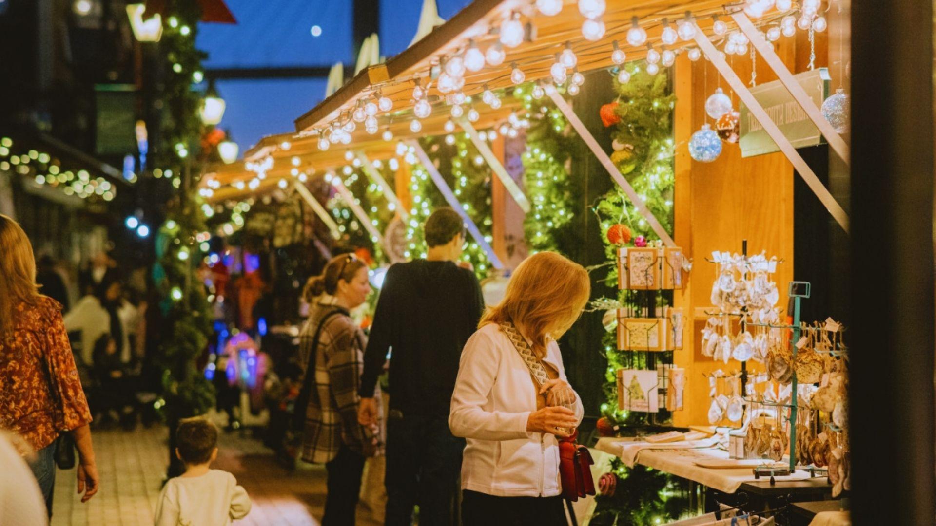image showing Christmas lights and holiday market.