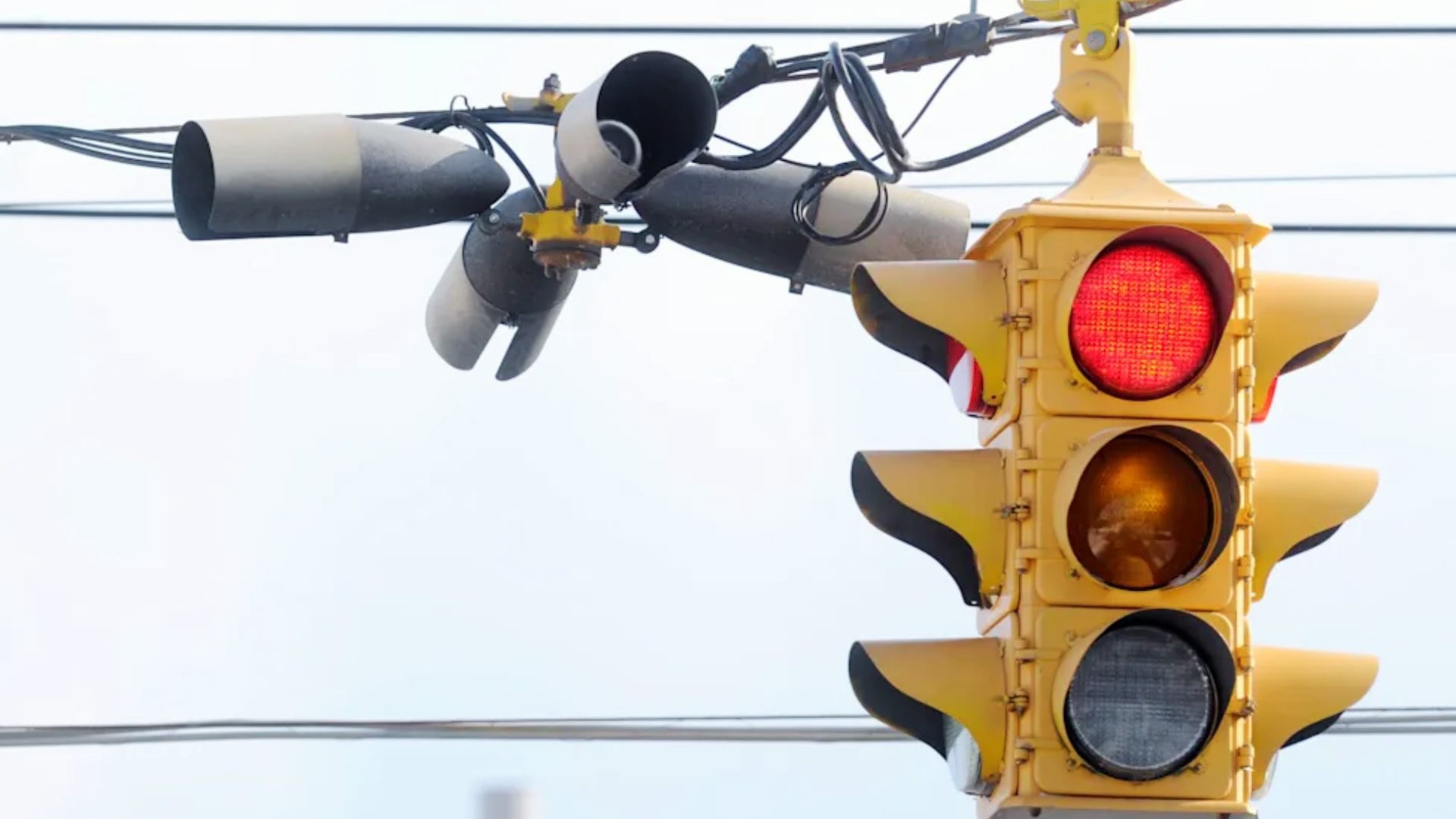 Yellow traffic signal showing red light at intersection in Georgia
