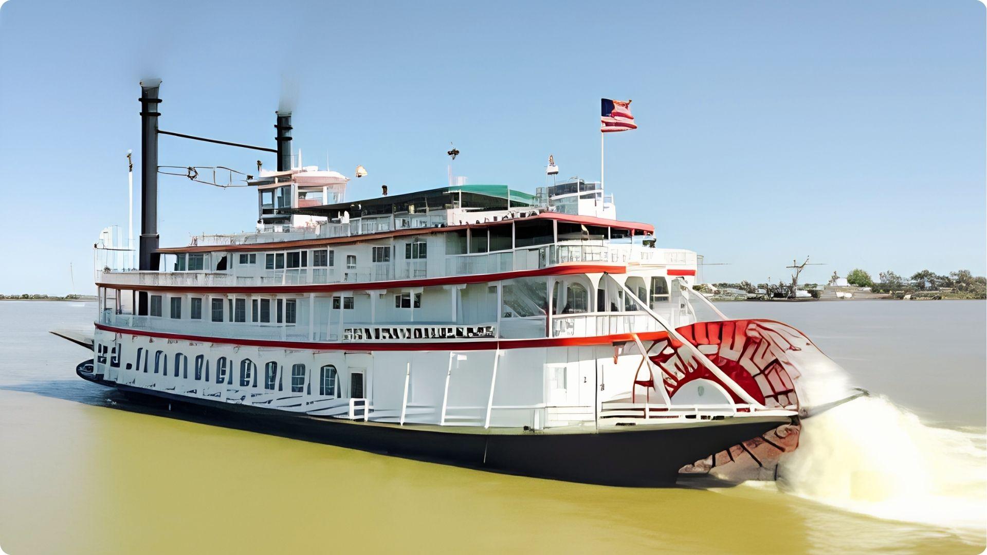 Historic paddlewheel steamboat cruising Mississippi River, popular sightseeing cruise near French Quarter