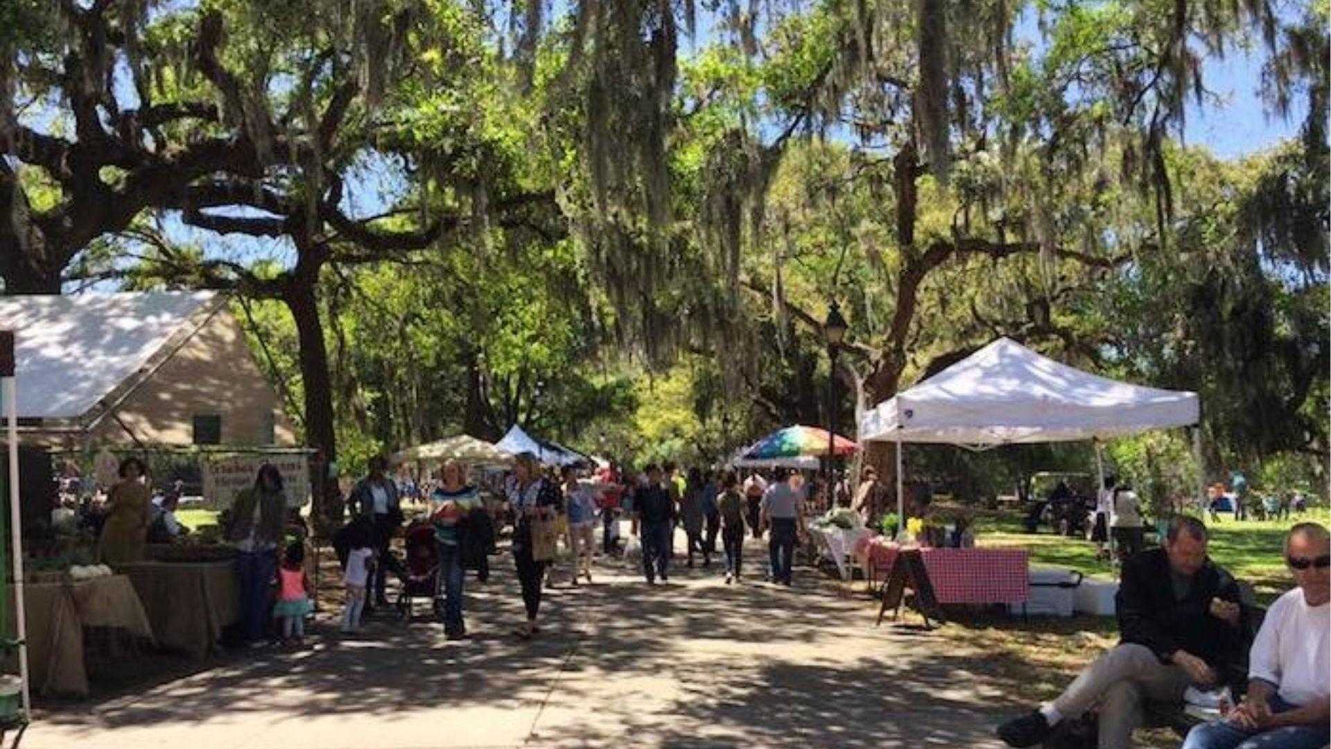 Forsyth Farmers Market with vendors under mossy oaks in Savannah