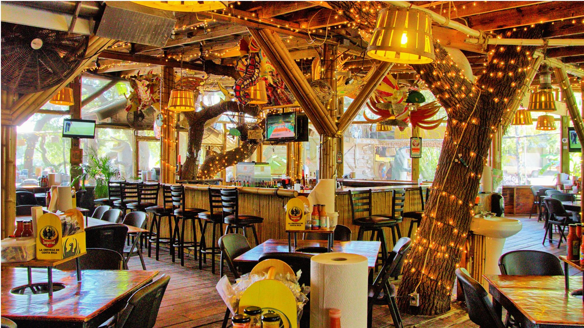 Festive tiki bar interior with string lights and rustic wooden decor in Savannah