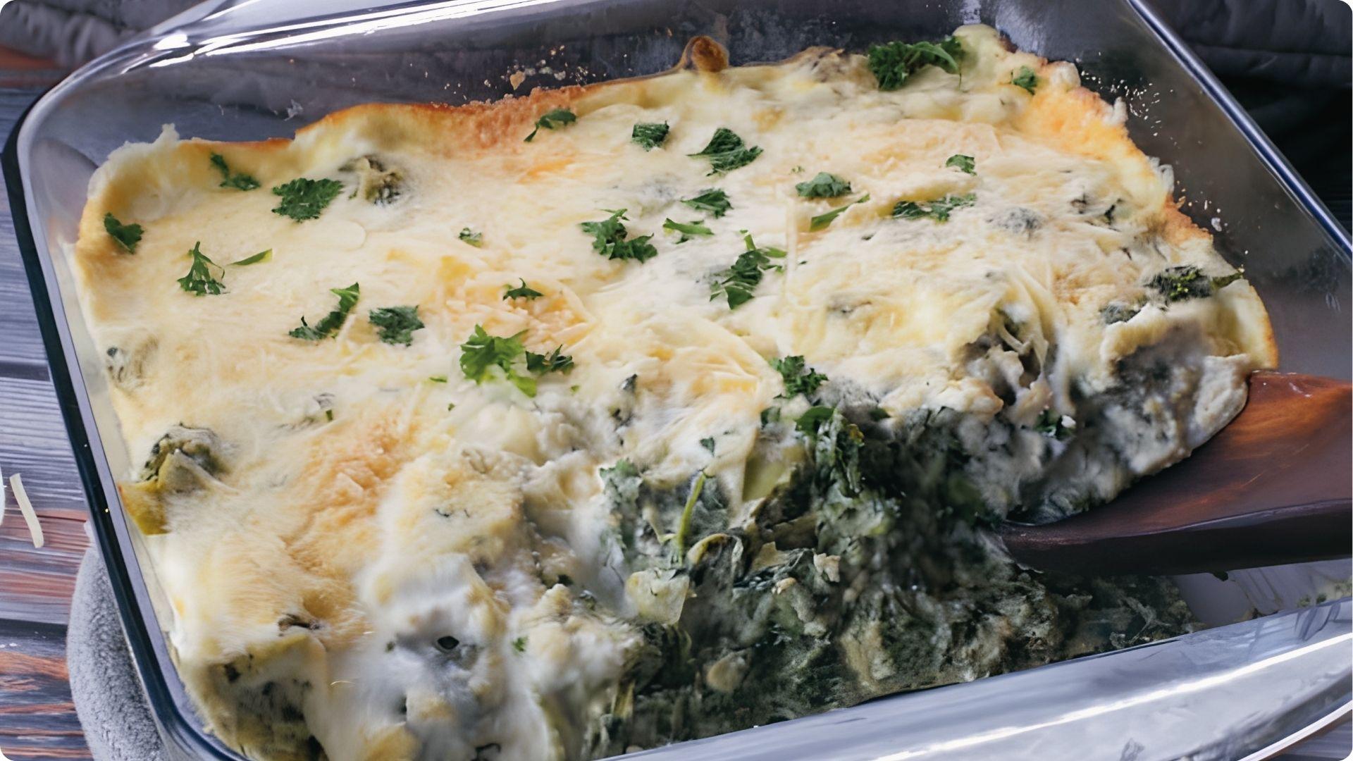 Creamy New Orleans spinach and artichoke gratin bubbling in glass dish, cheesy baked side dish classic.
