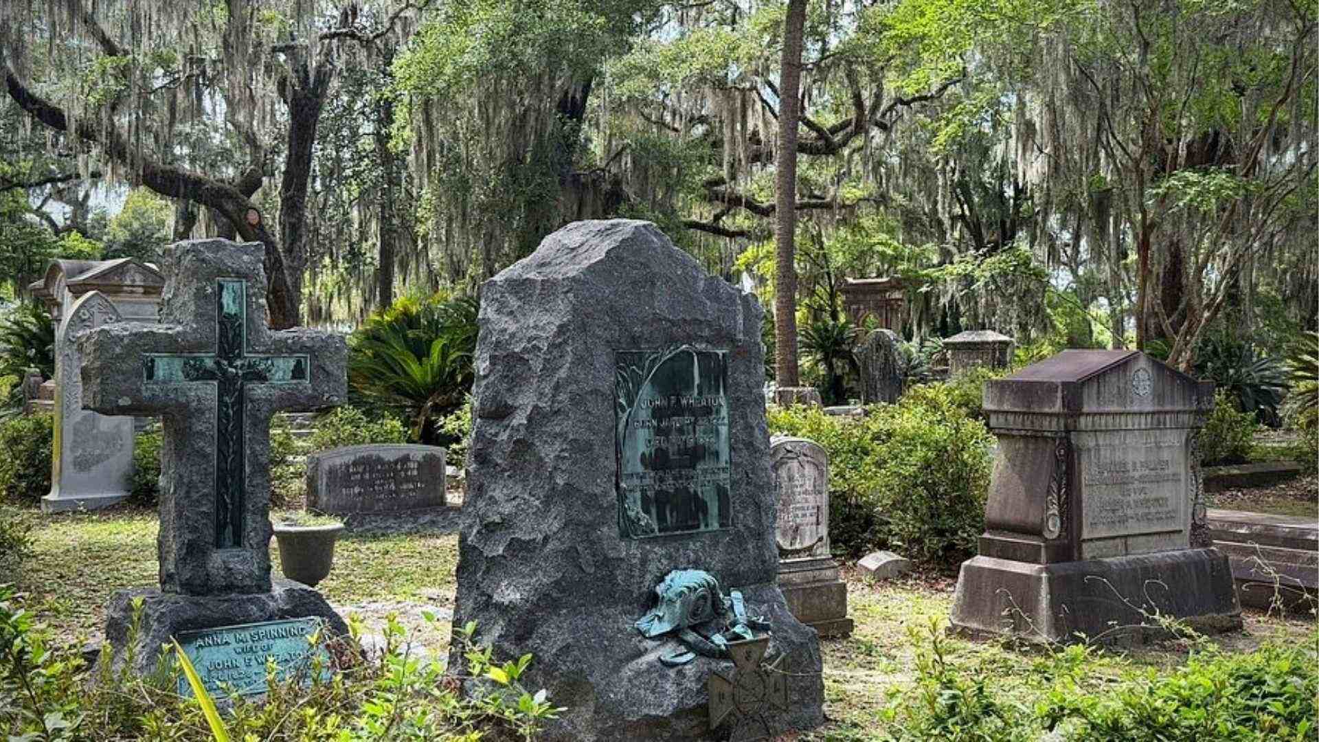 Historic tombstones at Bonaventure Cemetery with Spanish moss in Savannah