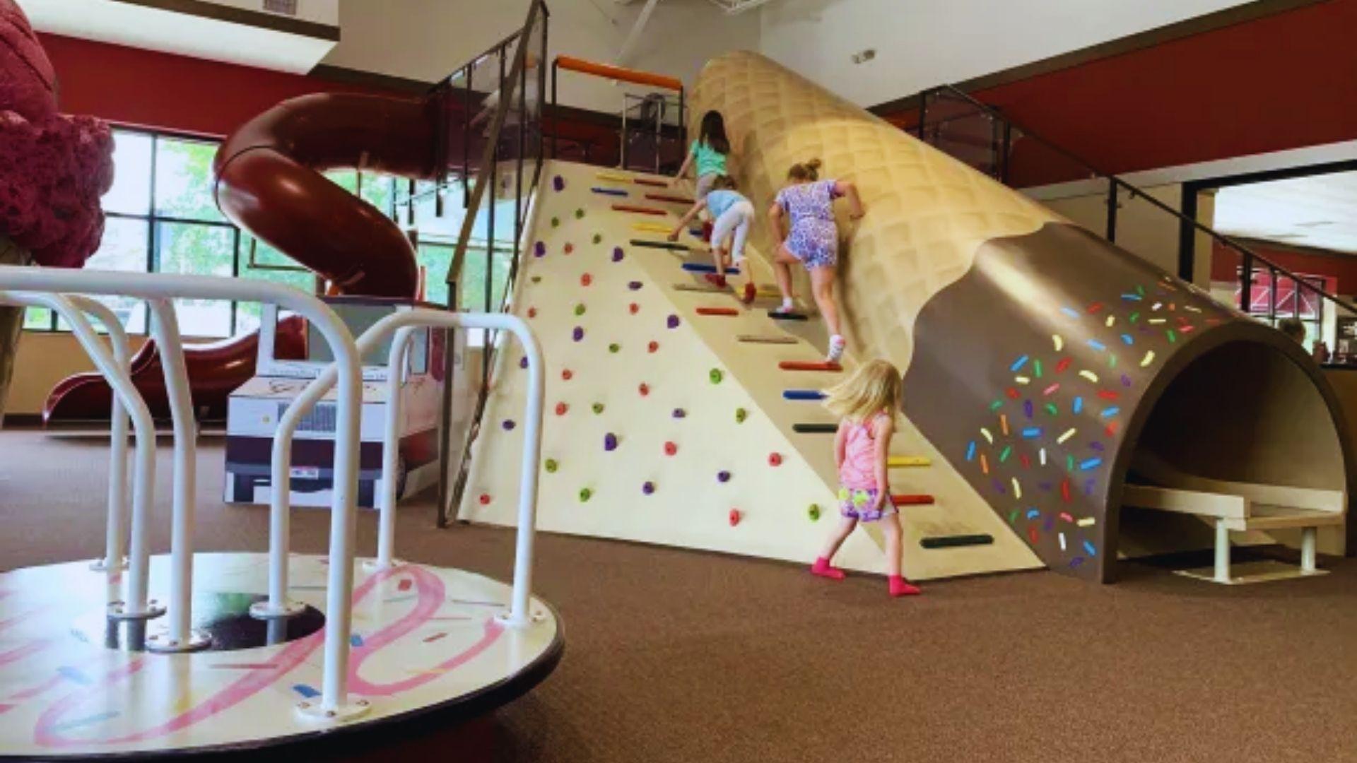 children playing in an indoor playground.